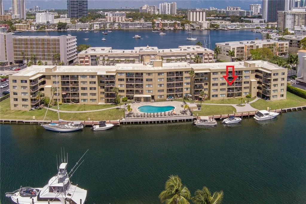 JUST MOVE-IN! Amazing 1/1.5 WATERFRONT unit with a lot of personality! Impeccable 2nd floor unit sold FURNISHED TURNKEY! Enjoy the view of the canal from your private open balcony. Updated kitchen with newer white cabinets & appliances. Porcelain tiles in living area & vinyl floor wood plank design in bedroom. Coffered ceiling with recessed lighting in living area. The unit has just been repainted. New A/C (2020). HURRICANE IMPACT windows & doors. Hot water is included in maintenance fees. Upgraded 1/2 Bath with vessel sink vanity. Spacious master suite facing the water with lots of closet space. Remodeled bath with new reglazing tub, newer toilet & vanity. Small pet ok. 40 years certification done. Waiting list for boat dock. 1 mile from the beach. Walk to shops, groceries & casino. WOW!
