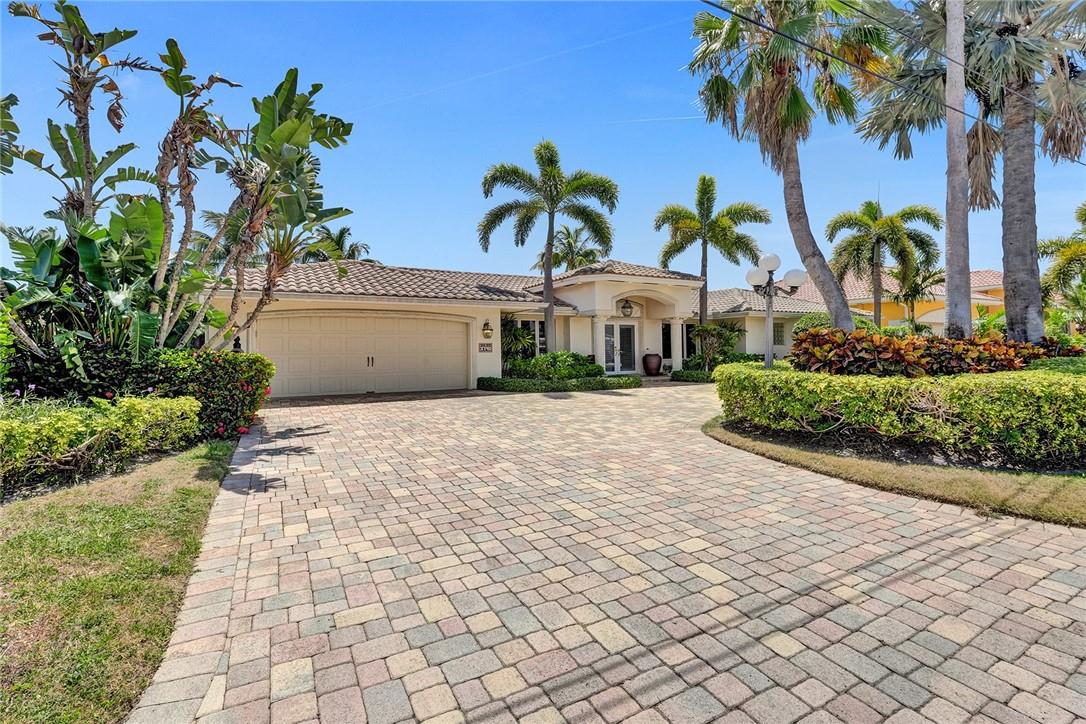 Tastefully reimagined home with everything you could need, in a manageable and low-maintenance size. Cleanly designed interior, with abundant natural light and pool and water views from nearly every room. Large and open kitchen with huge SubZero refrigerator and tons of cabinet spaces. Over-sized owner suite with spacious master bath AND private office and large walk-in closet. Two large, spilt guest bedrooms on opposing sides of the home allow privacy for everyone. Sparkling free-form pool centered on the large entertainment deck overlooking the 90' of deepwater dockage. No fixed bridge and quick inlet access. See this one today!