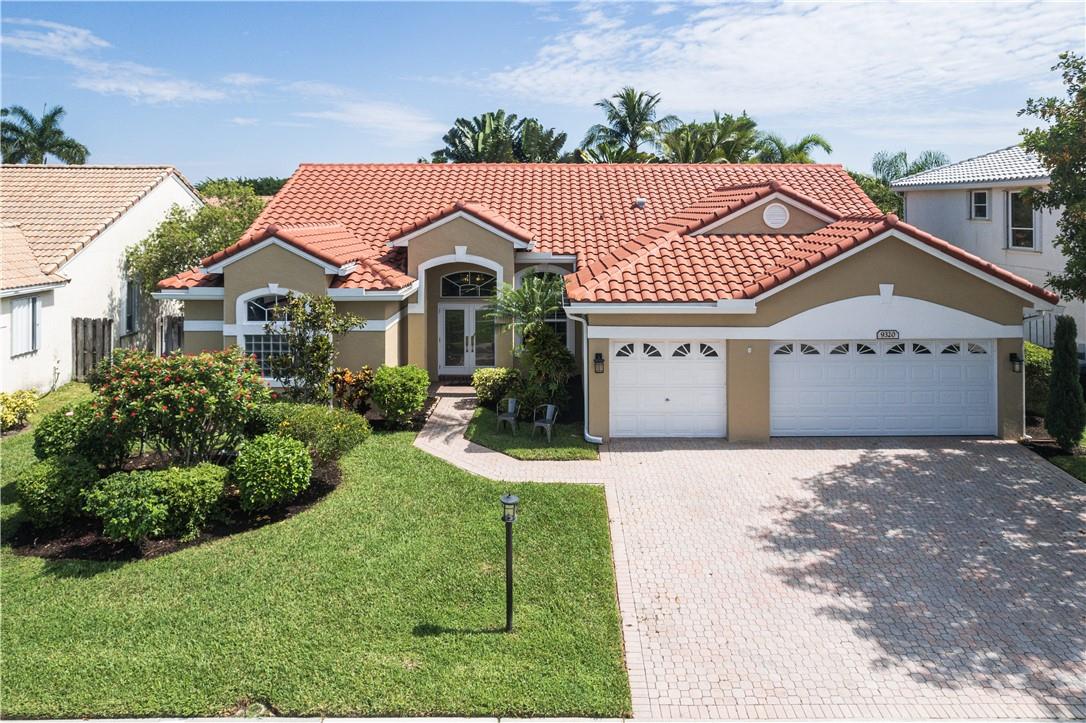 Fabulous 5/3 triple split pool home in Boca Landings (Boca Vista Estates subdivision). Home has facade appearing as three car garage but includes builder option of 5th bedroom and 2 car garage. Home features new roof (2021), all hurricane impact windows 2014-2015(except glass block in master bath) ,new front doors (2019) and new contiguous tile in main living area. Many recent upgrades (list in attachments).This home is meant for entertaining! It features a retro kitchen which opens to huge family room with heated pool/spa and an extra large screen enclosure for all of your parties! Beautiful plantation shutters on sliders and windows in main living space. Fantastic community with 2 playgrounds (one diagonally across the street), community pool, pickle ball, tennis, basketball and more! All supplements in attachments including floor plan, list of upgrades and all HOA documents.