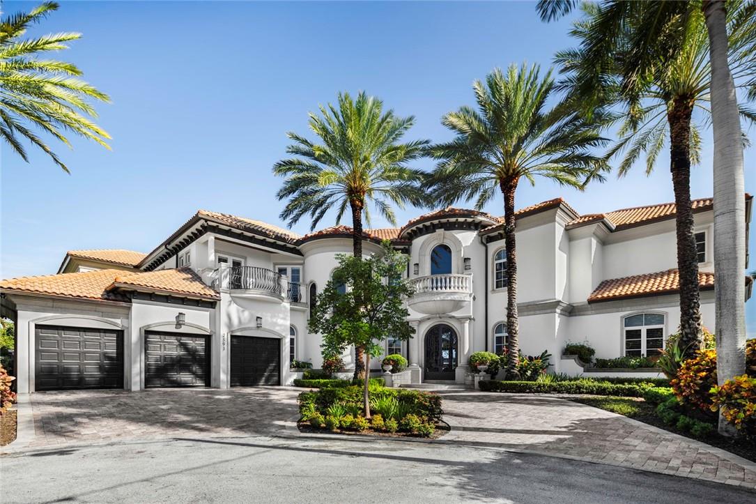 Welcome to a True South Florida Point Lot Estate, perfectly situated at the Convergence of the Intracoastal Waterway and Lake Santa Barbara. This Italian Inspired Home Design is perfectly positioned on a Quiet Cul-de-Sac and lives like a Five-Star Resort, with Dreamy Architectural Features including Mediterranean Style Arched Porticos and Walkways, Romantic Balconies, Sunlit Walls of Glass, with Bonus Loft and plenty of Work and Play Spaces, Beach Entry Infinity Pool, Artisan inlays on Gleaming Marble Floors. With an Extraordinary 270+ Feet of Expansive Panoramic Water Views surrounding this Lush Peninsula, enjoy an Everyday Show of Peaceful Early Sunrises and Fiery Tropical Sunsets! All Recently Renovated, there are 6 bedrooms, All Ensuite with Unique Personalities, Seven & One-Half Gorgeous Baths, Screening room, Elevator, Gym, 4-Car garage, Natural Gas Cooking, Multiple Wet Bars, 150 KW Gas Generac Generator.
