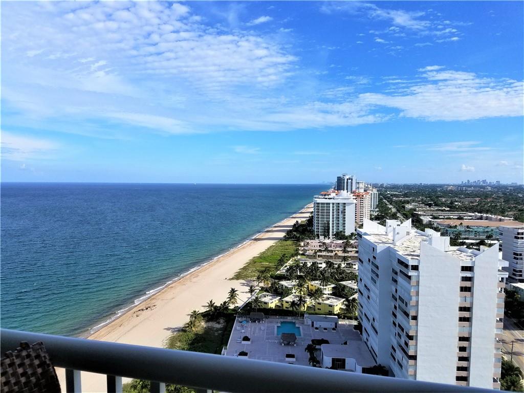 Spectacular unobstructed Ocean & Intracoastal views from both bedrooms and balcony in this luxury oceanfront building right on the sand!   Every room spacious and bright w/floor-to-ceiling windows, lg double doors open to the balcony w/gorgeous sunny south view of the beach as far as you can see;  impact windows and doors, lots of closet space throughout this spotless classic unit;  eat-in kitchen w/enclosed washer/dryer; oversz main bedroom has a nook with an amazing panorama.  This condo is a MUST SEE when considering this great location, whether for purchase, annual or seasonal rent.  World class amenities include oceanfront pool, tennis court, fitness center, private beach access, under bldg garage.  There is more: the 28th floor Sky Lounge is IMPRESSIVE!