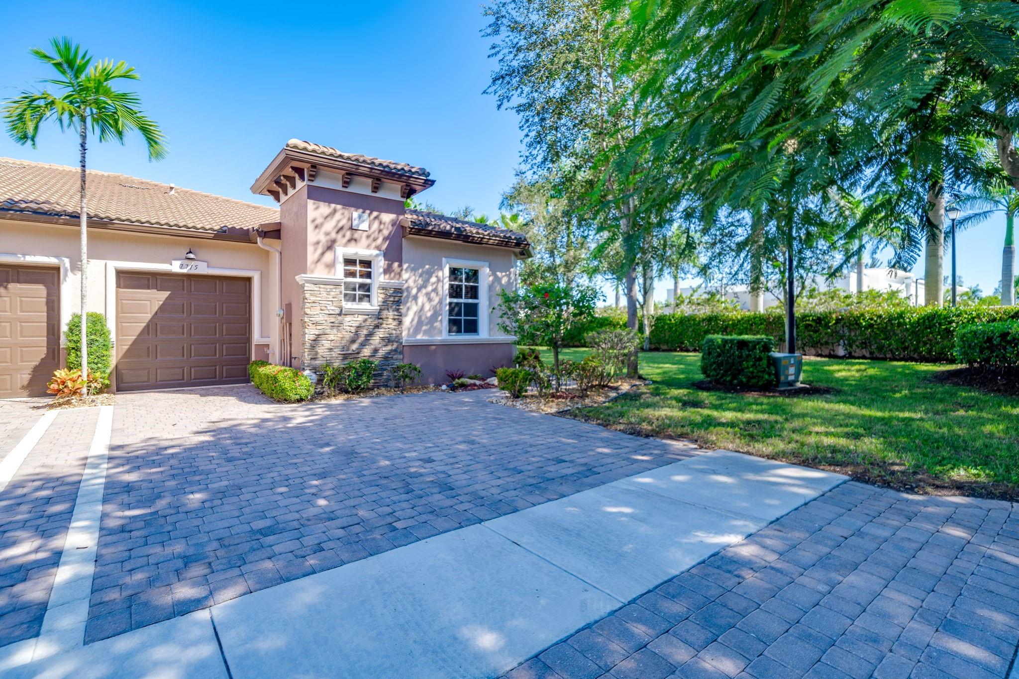 55+ Community at Villaggio Reserve – 1 story end-unit villa,  2 bed/2 bath with DEN & 1 car garage,  screened in lanai overlooking quiet & serene grassy lot. Kitchen boasts dark wood cabinets with glass fronts, stainless steel appliances.  Ceramic tile floors throughout.  All windows & doors are IMPACT.  Villaggio Reserve is a very vibrant 55+ resort style community with TONS of amenities for a very active lifestyle.   The Cabana Club, a 38,000 sf clubhouse with Cafe Al Fresco (breakfast/lunch),  fitness center w/ group classes, tennis pro shop, grand ballroom for shows, billiards & parties.  Adult pool, lap pool, kiddie pool, spa/jacuzzi, 5 Har-Tru tennis courts, 6 pickle ball courts & lots of shaded cabanas.  HOA includes roof, lawn care, exterior painting, basic cable and home alarm.