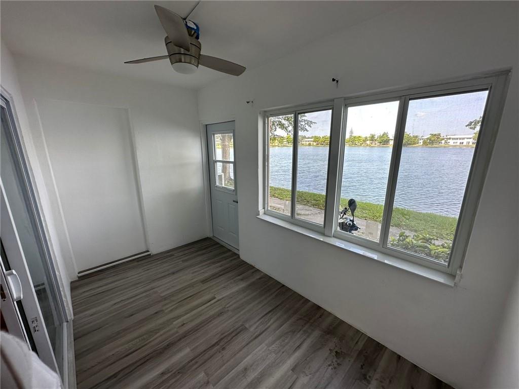Stunning newly remodeled 1st-floor condo, the unit is 2 bed 1 bath with a beautiful view to the lake from the large enclosed patio. The unit features all new luxury vinyl floor, new wood cabinets, a two-in-one washer and dryer, new water heater, and all impact windows! Condo is conveniently located near I-95 and 441, 15 minutes to Aventura mall, and a quick drive to the beach! The unit includes one assigned parking spot, and the building features a pool, clubhouse, and additional laundry facility on site. The unit is currently rented at $2500/month. This is a HOPA 55+ community and does not allow pets. Contact the listing agent with any questions!