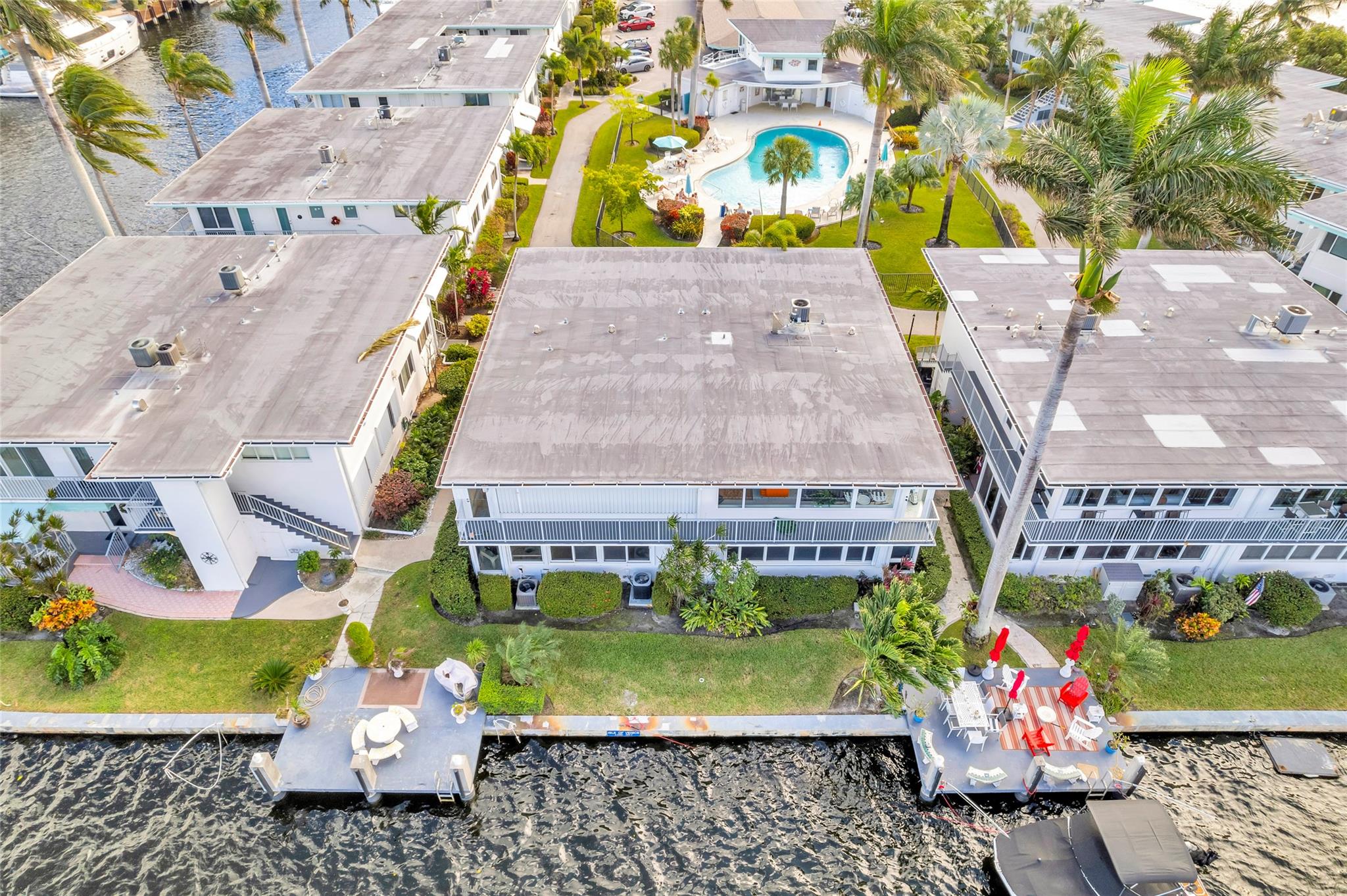 Finally! The Oasis complete package you've been waiting for! WATERFRONT resort living with amazing water views from almost every window (2)Prime setting overlooking the wide Rio Barcelona Canal yet walkable to Las Olas and the beach!  (3) Hotly appreciating Isle of Venice Dr. with designated "land share" interest and prime covered parking INCLUDED in price (4) TWO spacious master suites (5) updated kitchen/ bath and tiled throughout, central A/c & heat; (washer/dryer in unit) 6) Patio/ BOAT DOCK with ocean access (7) Outdoor grill. Owners can rent out after one year.  On site management ideal for luxury living with spacious landscaping surrounding large heated swimming pool on the tip of the Isle of Venice peninsula just off fabulous Las Olas Boulevard with abundant stores/restaurants.
