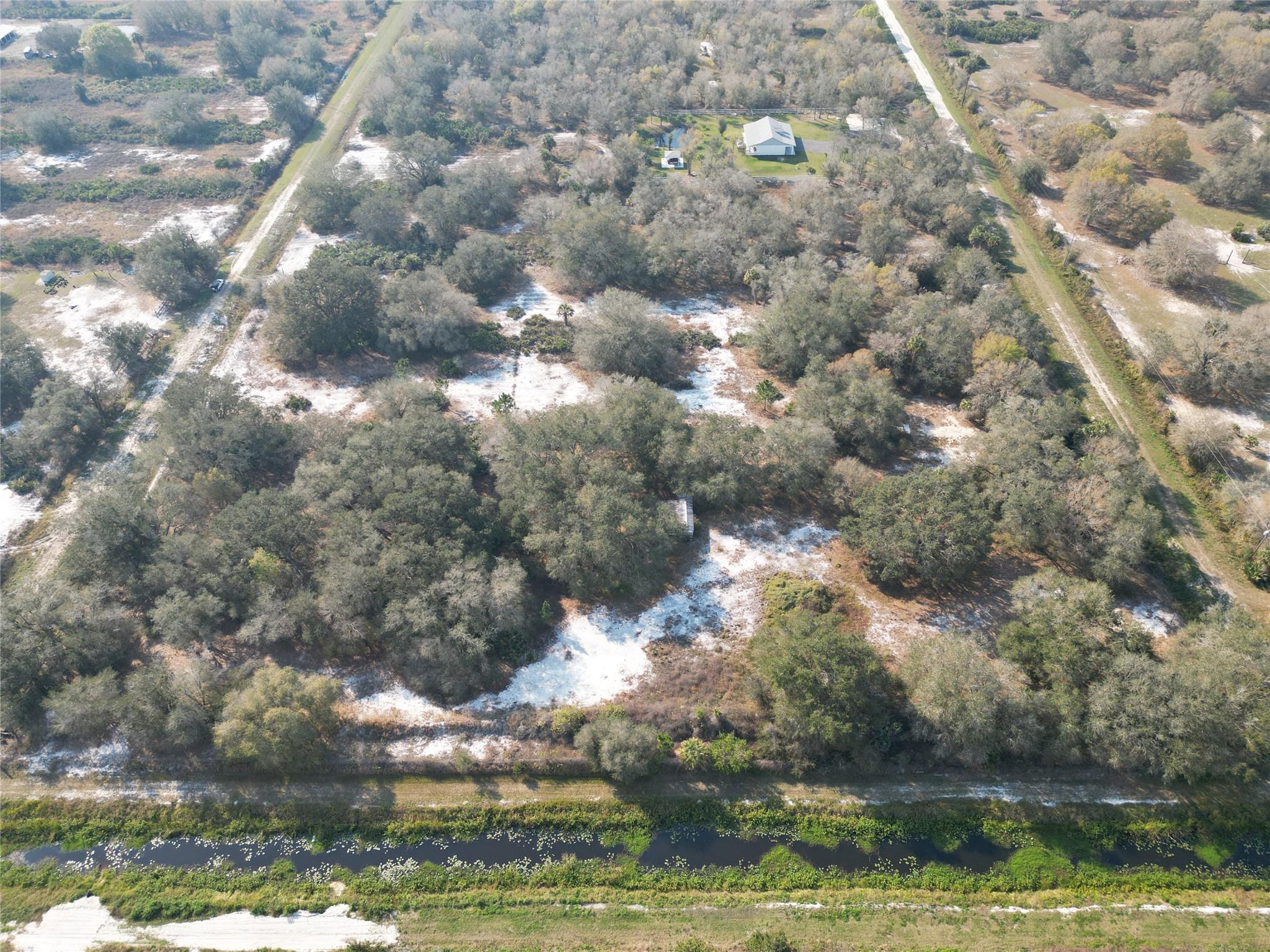 Enjoy serene sunsets, wildlife, & quiet!! Perfect 6.25 acre country retreat!( five 1.25 acre lots in total)  The adjoining 2.5 acres has a small mobile home and is available also for 80K, for a total of 8.75 acres! Loaded with beautiful grand father oaks, pines, & cabbage palms. Perfect for a large family retreat, as you may build a home or place a mobile home on each lot. Fenced & gated with a culvert in place. Has a drainage canal to the east of the property. Electric available. HIGH & DRY!! NO WETLANDS, FLOOD ZONE X ! Zoned Agriculture, so bring the animals. Located near the Kissimmee Prairie Preserve State Park, with many outdoor activities to enjoy!  Nature awaits! Call today. It is better to access the property through the back lots on 276th because that is where the gate is.