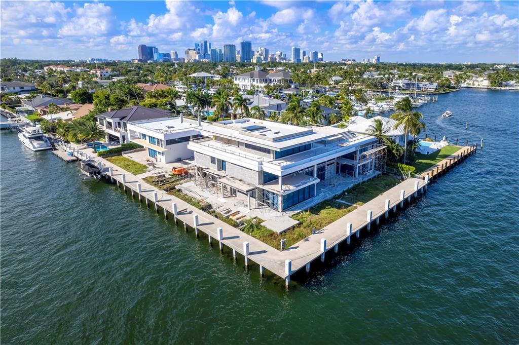 Fort Lauderdale’s Epic Luxury Waterfront Estate at the Ocean-to-Intercoastal Gateway to the Yacht Capital of the World. Perfectly sited on more than 1/2 acre is the one-of-a-kind 3-story modern masterpiece with over 15,000 square feet of indoor & outdoor elegant, sophisticated living. Over 345’ of deep water dockage. Straight line dockage for mega yacht. Garage storage for 16-20 cars. Breezeway connected Guest House. Spectacular 180 degree water views of widest part of Intracoastal only minutes to the ocean. Resort style pool plus second spa-style pool on 3rd floor deck. Construction is well underway! Perfect time to select your own fit and finishes. Details coming soon. www.LauderdaleYachtHaven.com