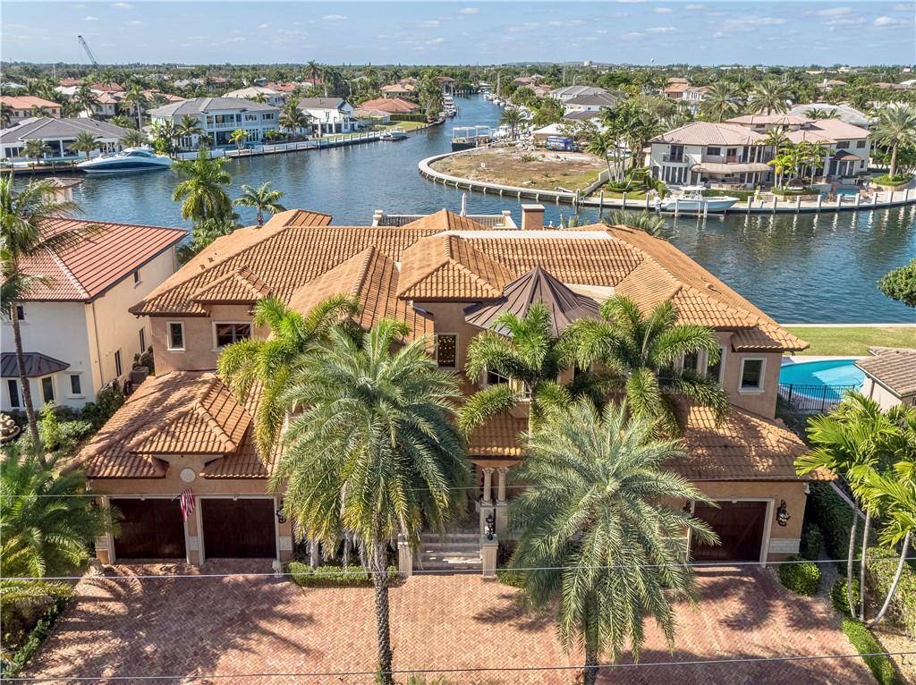 Exquisite Waterfront Estate in Lighthouse Point! The 7,258 Sq Ft mansion sits on 108 ft of inter coastal water with breathtaking views of one of the widest points in Lighthouse Point. Comprised of 5 full suites, a cinema, 2 bars, 3 kitchens, marble floors, a rooftop terrace, air conditioned garages and much more. All aspects of this home have been recently remodeled, from a complete pool rebuilding of the pool in 2015 to a recent resurfacing of all floors and a full overhaul of the movie theater. Other upgrades include: landscaping, lighting “inside & out”, CAT 5 Garage doors, Sub-zero & Viking appliances, gas fireplace, elevator, Crestron/Lutron lighting control system, full house integrated speaker system with SONOS, Keevo, NEST, Aqualink. A 32-camera CC wired camera system & much more!