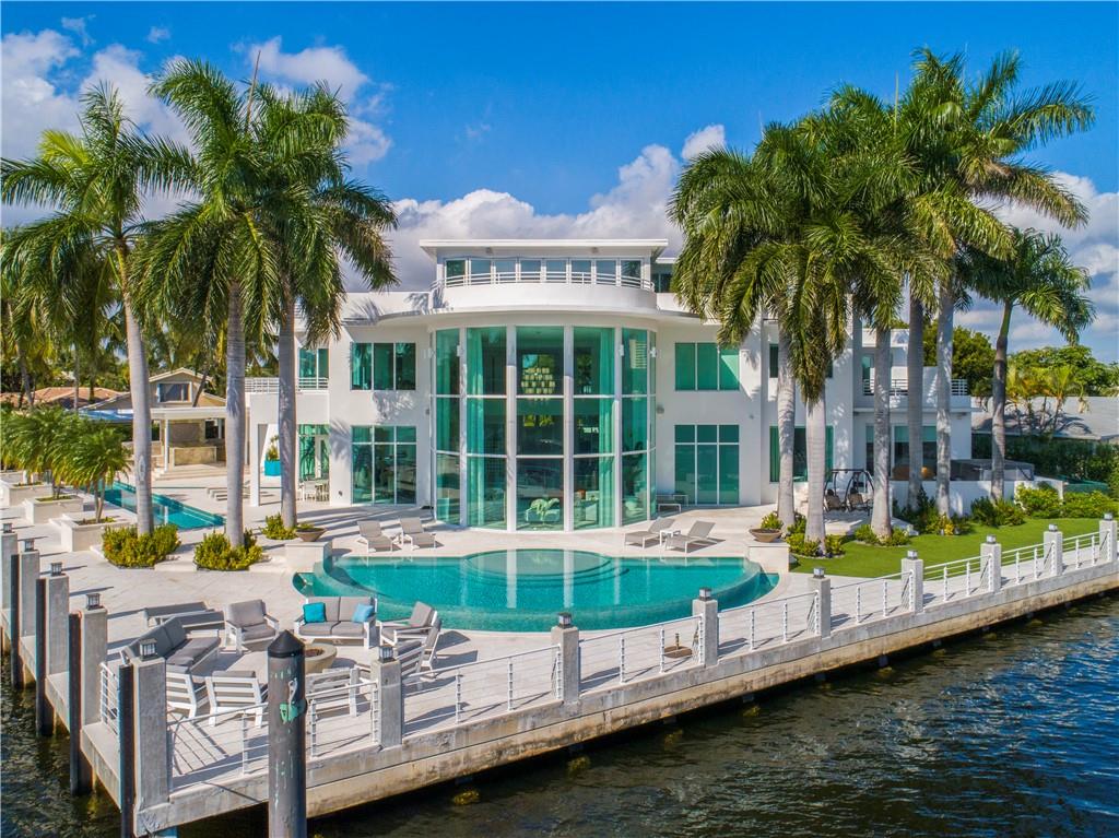 One of a kind, 3 level contemporary modern estate, renewed - masterpiece from its inception, where location meets luxury lifestyle, abundance, class, showcasing spectacular SE views of intercoastal w/unparalleled sunlight flow, inspiring “4ever young” feelings at best! Estate offers 5 bed's w/balconies, 7 full baths, 2 1/2 baths, office w/balcony, huge rooftop bar w/2800 sf of balcony and putting green/workout room, elevator, 3 Car Garage (w/lift 4CG), 267 feet of waterfront/concrete dock (125 intra/142 canal 9-10 feet deep), No Wake, water purification system, 72 kw Gen, 3 phase 600 amp service, dock 3 phase 2-200 amp pedestal and 1-50 amp pedestal, two pools, summer kitchen. Did I say “renewed” or $4MM+ New. AC, electric, lighting, plumbing, quasi everything but block, windows and doors!