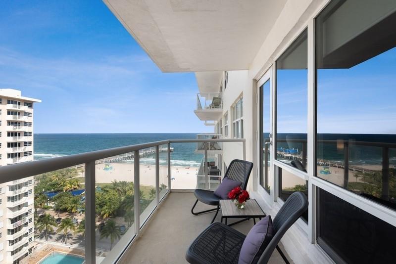 This is one you don't want to miss. This fully renovated, modern unit has views of the ocean and pier from every room. Walking distance to the newly constructed pier, restaurants, & bars. Covered catwalk where you can take in the beautiful water views. 24 hour security. The building has already undergone concrete restoration and replacing of balconies and windows. Most furniture available for sale. New A/C and water heater. Impact throughout. Washer & Dryer in unit. No rentals for the first two years. One pet permitted under 25lbs.