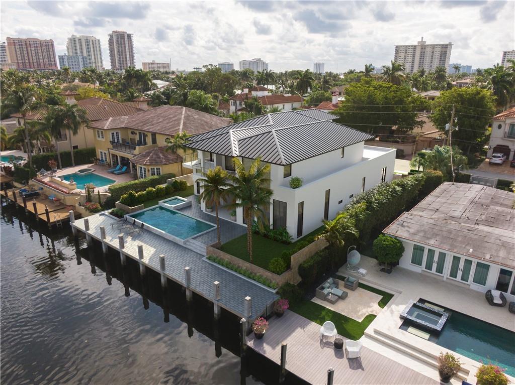 Located within the prestigious and exclusive neighborhood of Las Olas Isles, a sophisticated masterpiece by renowned architect Randall Stofft boasts 75' feet of water frontage with no fixed bridges. This one of a kind, new construction home has been designed as a tropical oasis with no detail or expense spared. It's open concept design & immaculate attention to detail throughout exemplifies the ultimate South Florida lifestyle. The home features over 5400 square feet of living space with every luxury and convenience factor carefully thought out from an outdoor entertainment area, elevator, 3 car garage, & crescent home system. Welcome to a truly spectacular estate showcasing a flawless contemporary design style which honors the exquisite quality of Ft. Lauderdale luxury.