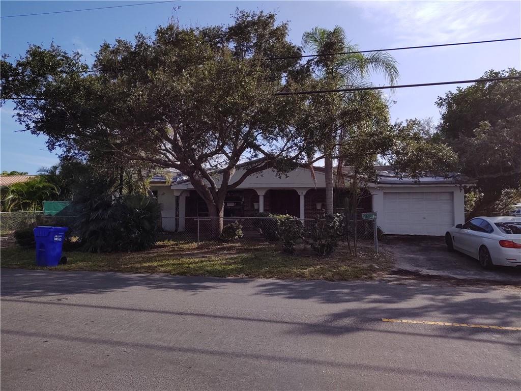 AMAZING OPPORTUNITY with this diamond in the rough. If you can handle a complete remodel, you have the opportunity to own your waterfront dream home. Great potential with this original custom built 1842 sq ft , 4 bed/2 bath home on the water off of Cypress Creek Canal. One fixed bridge (Federal Hwy) into Lettuce Lake and head out to sea via the intracoastal. Corner lot, pool, Approx 28 ft water front, Approx 10 ft deep canal.