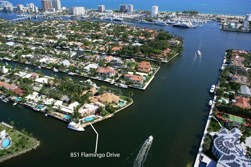 Las Olas Isles Trophy Point with one of the best panoramas in all of Fort Lauderdale. Approx 170 total ft seawall and current owner has kept two yachts of approx 110 ft and 65 ft at the the same time at the property in a "No-Wake" zone. All water vessels heading South towards the inlet will be in your view via both the Intracoastal and the New River. The home has Two primary living levels and a third floor lounge with rooftop access for parties with the widest vistas. The master suite is upstairs with a juice bar, spa, fireplace, and waterside terrace. The Two-Story Great Room has a wet bar, wine room, and direct water views. Four total bedrooms upstairs and 2 bedrooms on the entry level. Located in South Las Olas meaning quick ocean access for the boaters with only 17th St Causeway.