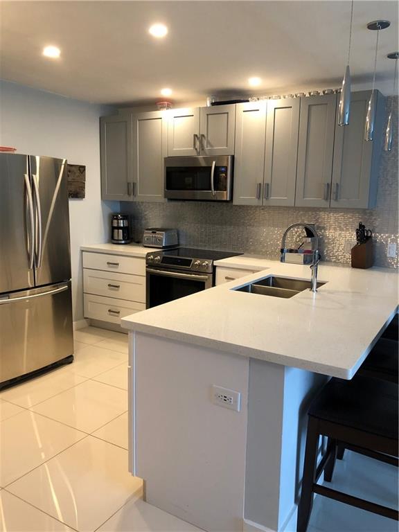Beautifully upgraded large 1 bedroom/1 bathroom condo located in prestigious Coral Ridge. This unit features large white porcelain tiles, gray shaker cabinets, quartz counter tops, stainless steel appliances and a custom built out closet. Condo is directly next to the pool and has great views. Washer/Dryer in unit. Conveniently located close to US1, shopping, entertainment, the beach, etc. Tenant occupied till end of 2021.