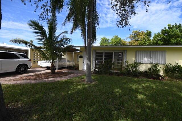 Quiet street in Wilton Manors only a seasonal rental. Carport is not available ( car in carport stays.) big back yard fenced. small pet acceptable.