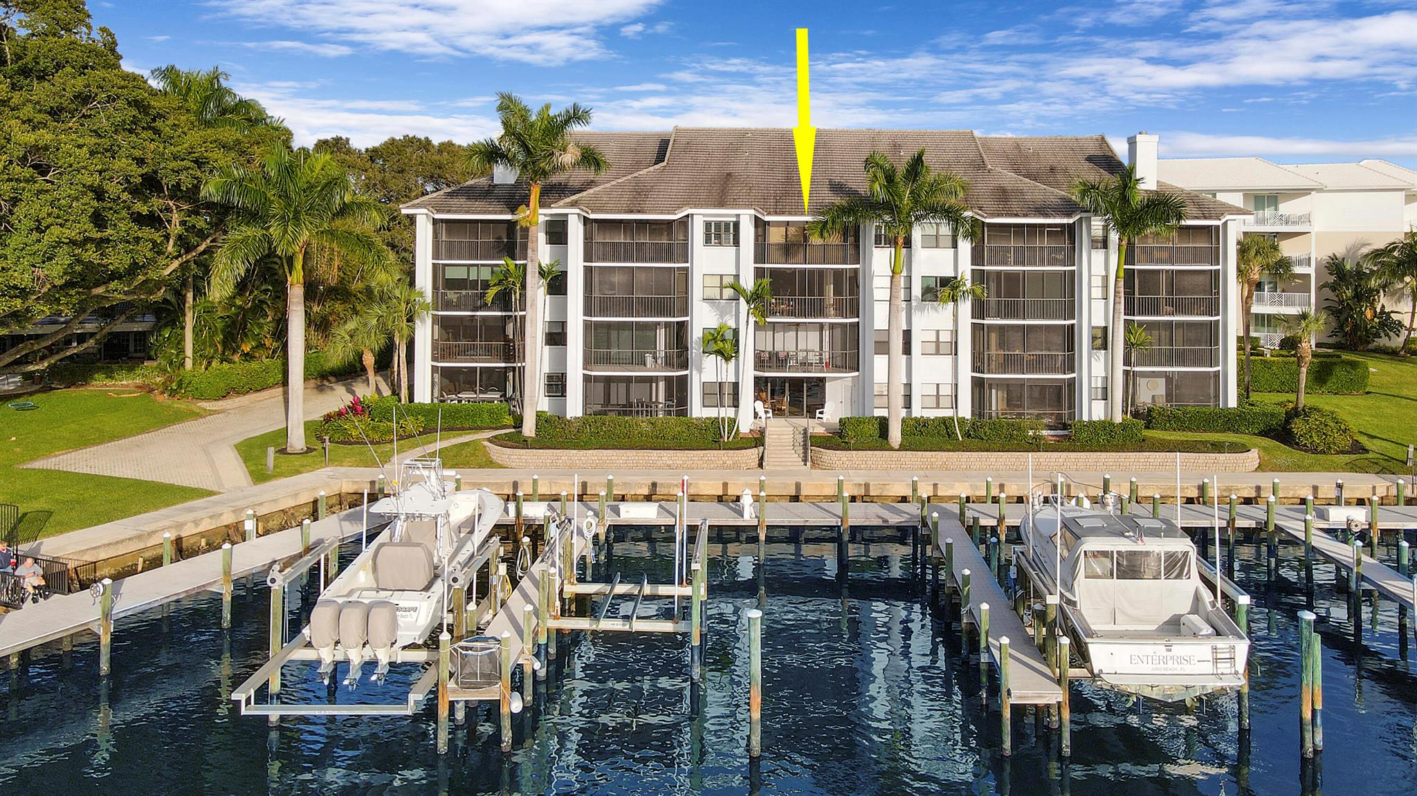 A Boat Owners Dream!! Gorgeous top floor condo located on the intracoastal in Bay Colony. Includes a private marina, resort style pool, hot tub, fitness center, clubhouse, tennis courts, etc. The unit boasts direct intracoastal & marina views with a private deeded 50ft boat slip & no fixed bridges.  The amazing layout showcases 4 glass sliders in the living area to view the stunning panoramic sunsets & a spiral staircase leading to a large loft /flex space/3rd bedroom, with vaulted ceilings & plentiful natural light all day long. Beautiful hardwoods in main living area & new tile floors in the master bed & bath, stainless appliances & an open kitchen for entertaining. All of this is just a bonus on top of the central location, being minutes to Juno Beach, restaurants & shopping!