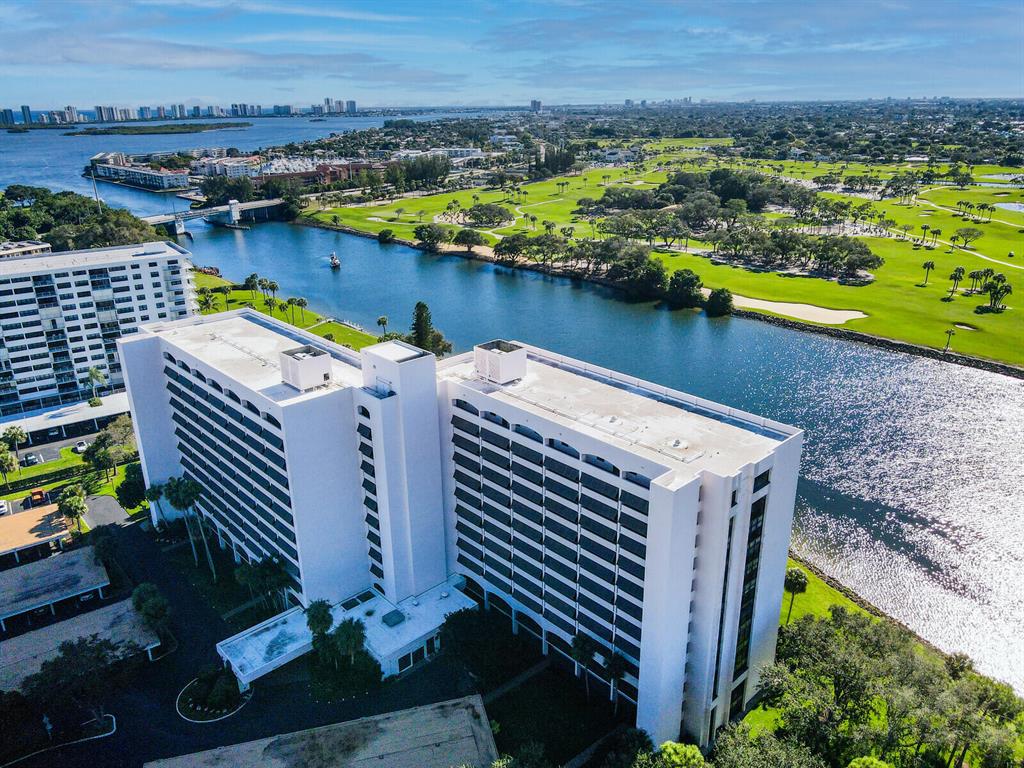Rare end unit with spectacular panoramic views of the Intracoastal, boating, & golf course.Renovated 2 bed, 2 bath. Large balcony with southern exposure. Open kitchen has quartz countertops, backsplash, & waterfall edge. Stainless steel appliances. Built in wine fridge.Renovated master bathroom has double sinks, separate tub & shower with frameless glass.New AC, tankless water heater, & updated breaker panel. Accordion shutters protect entire balcony, impact windows on northern side.Full size washer & dryer. Furniture negotiable.Assigned covered parking.Governor's Pointe features guard gate, fully renovated amenities, fitness center & sauna, club room. Pool overlooking the water w/ cabana & grill. Close to beaches, dining, shopping, NPB Country Club golf & tennis.