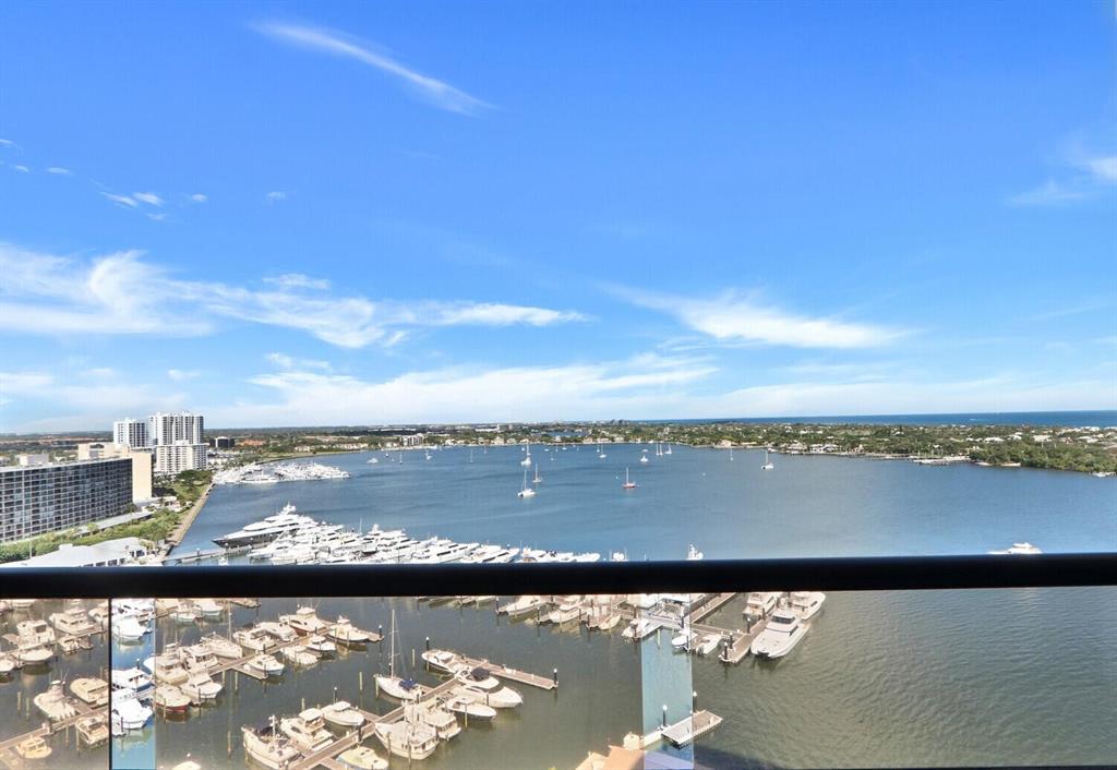 Pristine 2 bedrooms and 2.5 bathroom 15th floor condo overlooking the Ocean and Old Port Cove Marina. Breathtaking views from the covered balcony and all main living spaces within the condo. Floor to ceiling windows.  The 21x16 primary bedroom features its own private balcony and full bathroom, which includes 2 walk-in closets, dual vanities, a walk-in shower, and soaking tub. Guest Bedroom Suite is located on the other side of the condo away from the Primary Suite.  Many beautiful updates. Full size laundry room w/extra storage. This is a luxury building w/secure entry lobby, 24-hr concierge, fitness & pool (currently under construction), workshop, library, and community room. This community features a waterfront walking path, mega-yacht marina, on-site restaurant &24-hr manned gatehous