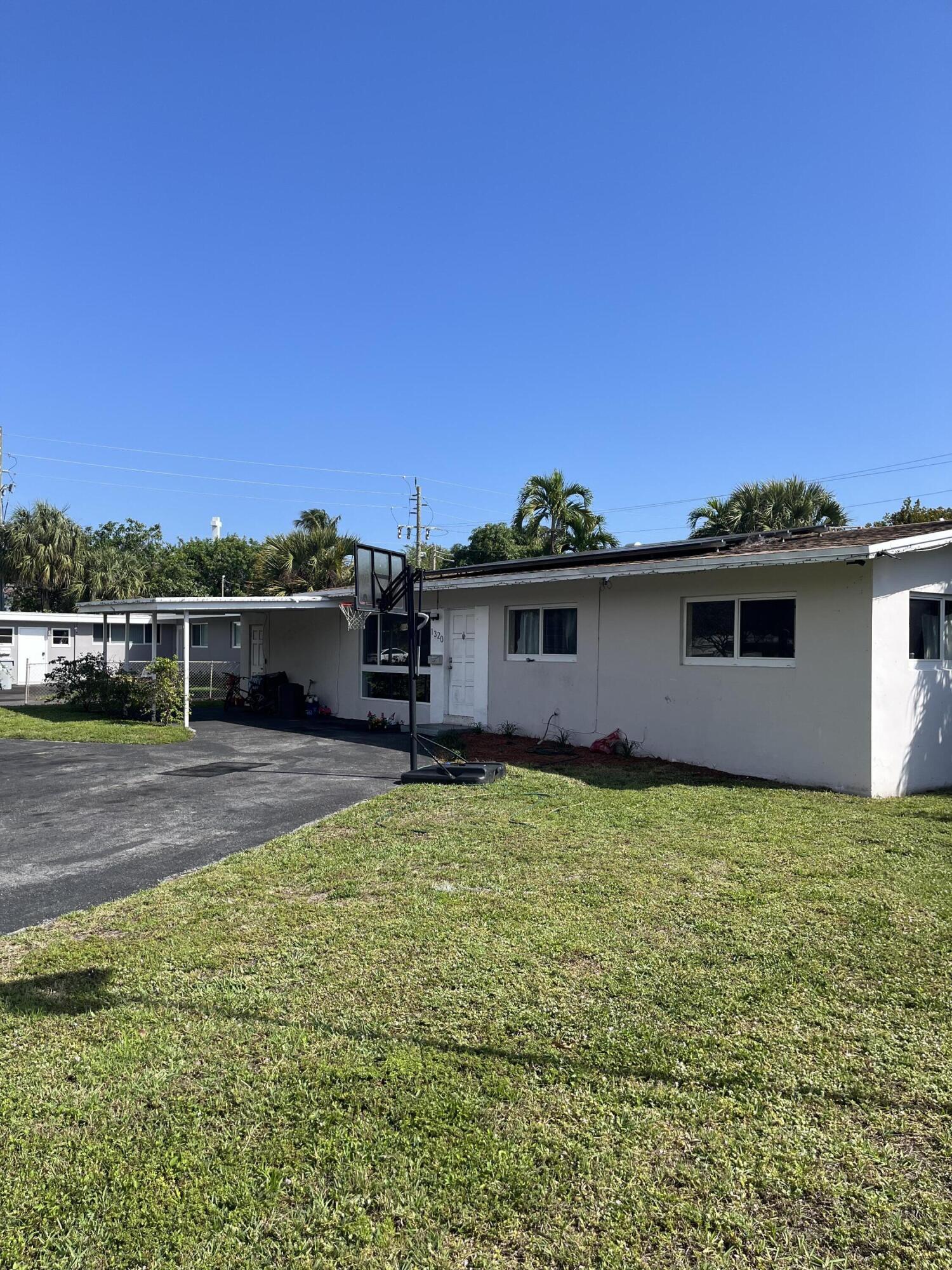 3 bd/2 ba less than 1 mile to the beach! Enjoy granite countertops and stainless steel appliances along with spacious open living areas with tons of natural light. Other features include tankless water heater, mud room,  impact windows throughout. Layout could facilitate a multi-generational family home. No Association. Solar Panels (not paid in full) balance will be finance by new buyer in property taxes assessment PACE). There is extra living space with its individual entrance that can easily be converted for an in-law quarters or rental income space.