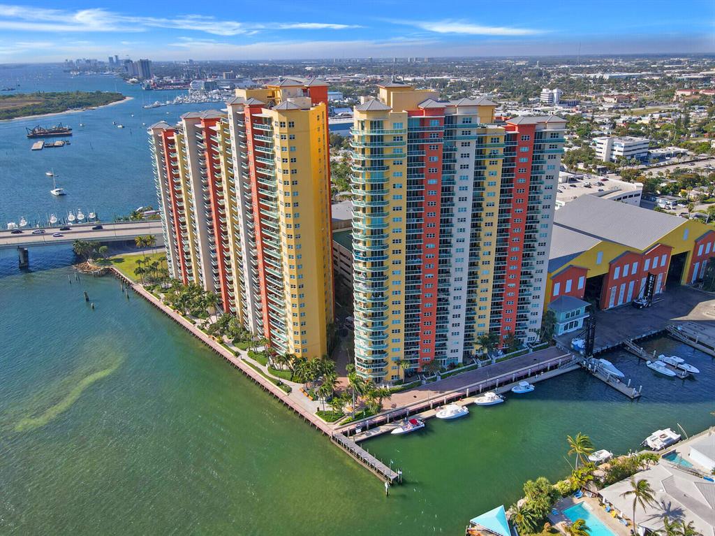 THIS IS THE IT - A MILLION DOLLAR VIEW!  Absolutely stunning 2 BR + Den/Office Room (possible 3rd BR) and 3 full bathrooms with some of the best Intracoastal views in Palm Beach County. Enjoy your coffee or evening cocktails on your private balcony overlooking the Intracostal Waterway & ocean. This beautiful condo is move-in ready condition and features a spacious kitchen open to dining room and living room, large master bedroom with walk-in closets and spa-like bathroom and a large guest room. Stunning Italian marble flooring thru-out the condo with plantation shutters on all the windows. Marina Grande is centrally located w/ resort style amenities, including garage parking, heated pool, jacuzzi, tennis & pickleball court, bbq grills, community room, valet parking, fitness center, & more.
