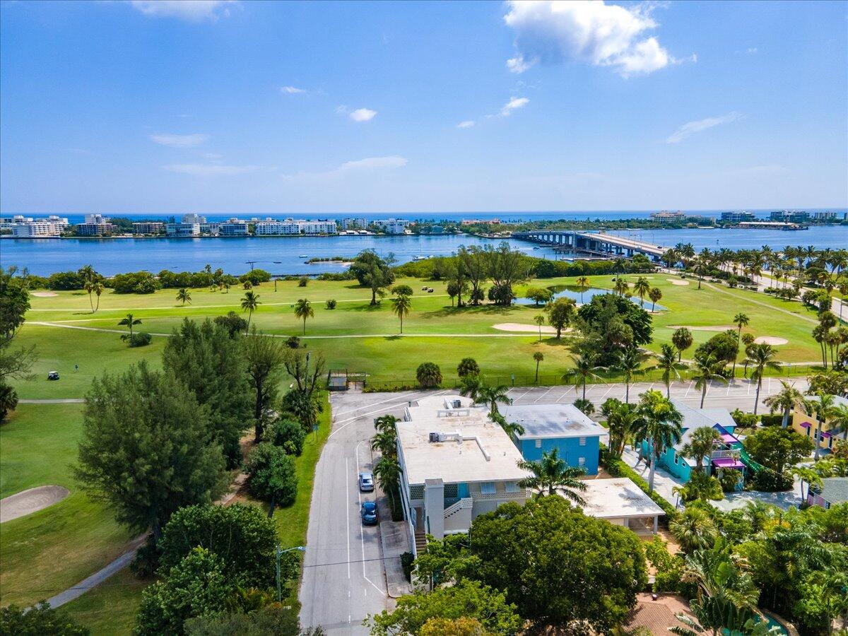 Beautifully updated 2 bedroom 2 bathroom first floor condo! Conveniently located in Lake Worth Beach, this condo is just steps away from the intracoastal, fantastic dining, great shopping, and the Beach!  Enjoy golf course and Intracoastal Water views from the large wrap around patio.  This condo has been recently updated with all new wood tile flooring throughout the main living area.  The kitchen was also recently updated with beautiful new cabinetry, stainless steel appliances, center island with seating, and subway tile backsplash.  Both bathrooms are new and have been tastefully renovated.  This condo has quiet and cozy location and is perfect for seasonal or full time living!