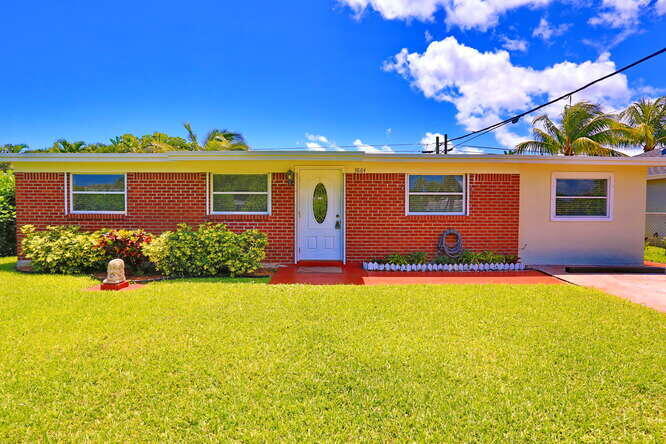 Location, Location, Location Wonderfully maintained single family home in the heart of Palm Beach Gardens. No HOA! Walking distance to The Gardens Mall and Downtown at the Gardens. Beautiful Loggerhead Beach is just less than 1/2 mile away. Eisenhower Elementary is an ''A'' Rated elementary. Close to I95 and the Turnpike. Lots of family activities, restaurants and movie theatre.  Home features a split floor plan with brand new luxury vinyl wood flooring and tile. Home can easily be converted to a 4 bedroom. Separate laundry/pantry room inside home. Yard is completely fenced in. Very private with beautiful landscaping. Roof was redone in 2020. Water Heater replaced 2020. A/c was replaced 2015. Automatic Sprinkler System that runs off a well.  This home is a Must See!