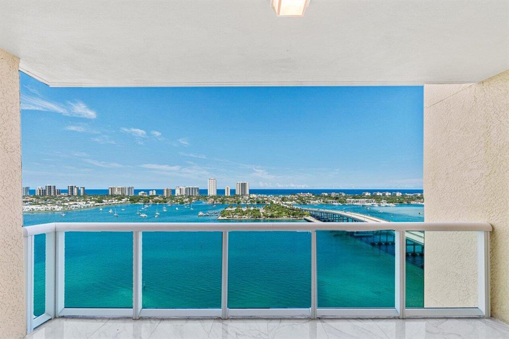 Beautiful 20th floor 2 BR+den, 2 BA w/ coveted direct Intracoastal & ocean views! Impact glass, semi private elevator access. Open concept, porcelain tile floors. Split floor plan, spacious primary suite has his & her walk-in closets. Marble primary bath w/double vanity, jetted bath, & water closet. Assigned parking in covered parking garage & climate-controlled storage unit. 24/7 manned gate, valet, tennis, pickleball, walking path w/gazebo, covered rooftop oasis w/pool, spa, BBQ areas, clubhouse, billiard room & fitness center. Adjacent marina w/dry docks available. Jump on your boat effortlessly & be on the ocean in minutes; no fixed bridges! Pet friendly. Minutes to nationally ranked snorkeling/diving at Blue Heron Bridge. Waterproofing project to begin fall 2022, contact mgt for info