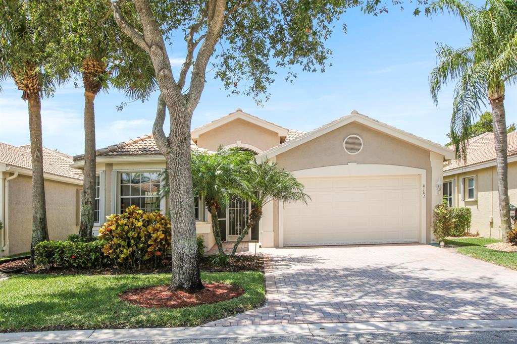 Want a trophy home in paradise? Look no further. This gorgeous 3/2.5 (2/2.5 plus den/ofiice) in the gated GL Homes 55+ community of Valencia Shores is ready for the discerning buyer.Situated on an interior canal in one of the premier communities in South Palm Beach County. Upgaded porcelain tile on the bias throughout,  tray ceilings, crown molding, lots of faux painting throughout that accentuates its beauty, granite counters, stainless appliances in the kitchen, surround sound speakers throughout, and accordion shutters for your safety and peace of mind. Furniture is negotiable. Your chance for a home out of Architectural Digest. Take a look and fall in love.