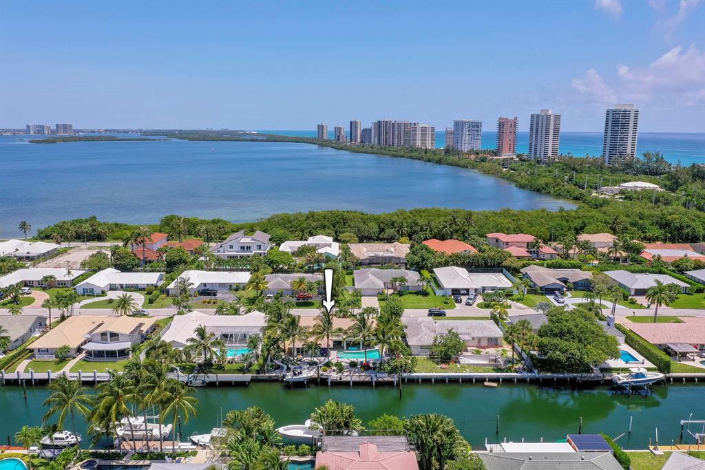 Singer Island boater's retreat! This beautifully remodeled 3BR, 3BA, 2-car garage pool home sits directly on the Intracoastal with 90 feet of water frontage! Featuring a new 15,000-pound elevator lift & a new dock on a deep-water canal this is perfect for the boating enthusiast. Located between the Ocean and Intracoastal with direct ocean access, this canal has turn around space at the end making it a most desirable location in this wonderful seaside community. With a split floor plan and a large open newly renovated kitchen and living room, you can enjoy the home as it is, build a 2nd floor to increase square footage, or even build new! Outside you'll find a large, covered patio with electronic storm screens and a saltwater pool with lush landscaping, perfect for entertaining.