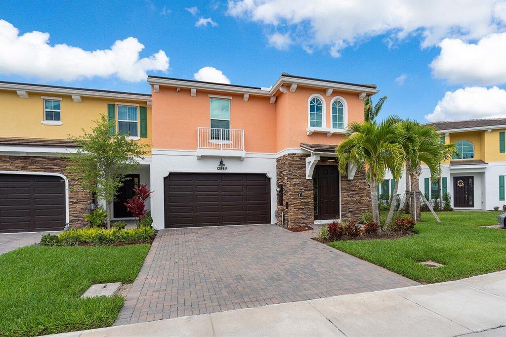 Welcome to this BRAND NEW townhouse located in Trevi Isle of Palm Beach Gardens! This turnkey townhouse features 3 Bedrooms, 2.1 Bathrooms, with nearly 2,000 Living Sqft. The downstairs includes a large open concept kitchen, master bedroom, laundry room, and a half bath for guests. The upstairs features two guest bedrooms with a full bathroom and a generous loft area. This corner unit boats numerous upgrades, which includes complete HURRICANE IMPACT windows/doors, a two car garage, and a covered patio with gorgeous lake views. Trevi Isle is conveniently located just minutes from I95 and the Turnpike and just a short drive from all that Palm beach Gardens has to offer. The low HOA fees include a security gate, community pool, and landscaping! Trevi Isle is a quiet, gated community with just 50 townhouses and is zoned for Marsh Pointe Elementary, Wastson B. Duncan Middle, and William T. Dwyer High School. Call today before this turnkey property is gone!
