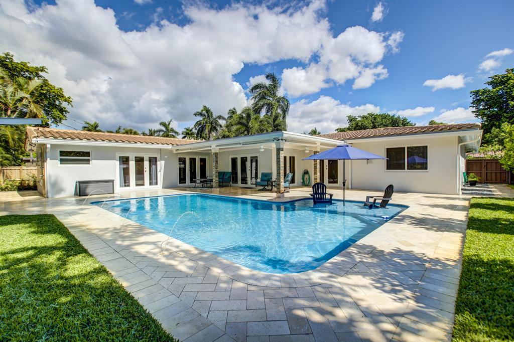 A unique opportunity to own a gracious estate renovated with state-of-the-art finishes in the heart of Wilton Manors. Striking newly renovated home, superbly located minutes from Atlantic Ocean and the best that Fort Lauderdale and Wilton Manors have to offer. 4 bedrooms plus an office with closets that can be easily the 5th bedroom, 3 bath, 2 car garage with an oversized saltwater pool, all hurricane impact windows and doors, roof replaced in 2020, all new porcelain floors throughout, brand new chef's kitchen with 2 sinks and pot filler, this home leaves nothing to be desired. Facing due south, the natural light and stunning finishes will overlook a lush landscape design and exciting pool with covered patio and outdoor shower. Close to the beaches, highway, restaurants, and shopping