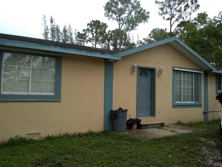 GREAT OPPORTUNITY TO LIVE IN BEAUTIFUL  DESIREABLE  LOXAHATCHEE. 1.29 ACRES IT IS IN NEED OF FULL RENOVATION MAKING AN IDEAL CHOICE FOR INVESTORS OR ANYONE WISHING TO CREATE A BEAUTIFUL LIFESTYLE IN LOXAHATCHEE.COMMUNITY OFFERS HORSETRAILS,BALL PARKS PARKS,RESTAURANTS AND BUSINESS CENTER. EXPERIENCE THE FEELING OF LIVING AWAY FROM IT ALL WHILE MAINTANING CLOSE PROXIMITY TO WELLINGTONS AMENITIES.AS IS FOR CASH  ONLY