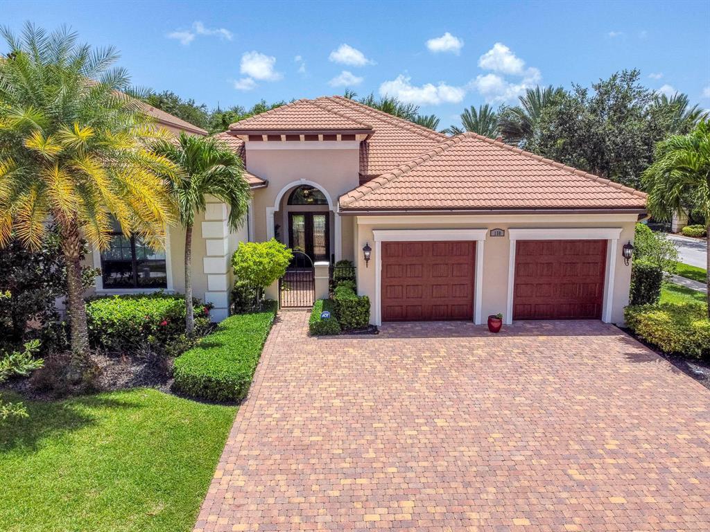 Located in the desirable private community in Gardenia Isles, come see this sophisticated, fully upgraded, light & airy 1-story, 3BR/3.2BA + DEN home. A NO club membership dues community. Top-of-the-line appointments include cypress & mother of pearl ceilings, walnut flooring & upgraded lighting throughout. Custom mill work line all of the sky-high ceilings & doorways. Gourmet kitchen features new Cambria quartz countertops, stainless steel Thermador appliances, & an in-island sink. The elegant master suite features custom walk-in California closets & Calcutta marble master bath. NASA-approved hospital-grade air cleaner system. The spa & pool grace the luscious tropical landscape. 15 minutes to PBI.