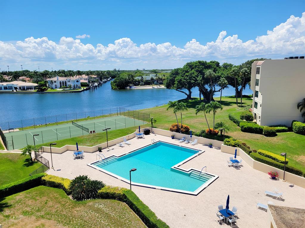 Great investor/contractor opportunity! Spacious 2-story Penthouse w/ fireplace, located in a prime location on the Intracoastal Waterway. Entry level has LR, DR, kitchen, den/office/3rd br & a half bath. Upstairs, you'll find 2 brs, 2 baths & laundry closet. Everglades is a boutique-style building, tucked far back from the road, offering a secure entry lobby, pretty manicured grounds, pool & tennis. 1 carport parking space + storage closet. Watch boats & the Holiday Parade from your 2 balconies. Walk to popular restaurants & shops, right across the street. Note: This unit had water damage. A/C has been off for an extended period of time. Mold is visible throughout. There is huge value potential here.  A remodeled unit on a lower floor sold for $949k. Renovate and you'll have a showplace!