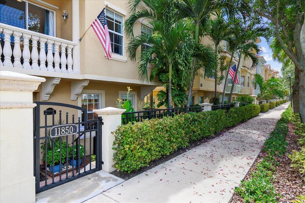 Come see this beautiful 3 bedroom plus an office, 3 full bathrooms plus one-half bath End Unit townhome in the highly desirable community of Harbour Oaks in Palm Beach Gardens!  This special home has lake views and lots of natural light and features Impact Windows on the 2nd & 3rd floors and panel shutters on the first floor. The gorgeous kitchen was updated 2 years ago and has white, soft closing cabinets, stainless steel Samsung appliances, Quartz countertops, huge, organized pantry loaded with storage space and a butler's pantry. Laundry is conveniently located upstairs, and Washer/Dryer is 1 year old. Top of the line A/C 1 year old.  3 bedrooms upstairs all with beachy laminate flooring. 3 bedrooms upstairs all with beachy laminate flooring. The primary bedroom is upstairs, and the bathroom features double sinks, separate shower, and roman tub. The first-floor office/den has a full bathroom.  2 car garage! Harbour Oaks is a beautiful, gated community in the heart of Palm Beach Gardens located across from the Gardens Mall and close to everything! The clubhouse has a resort style swimming pool and fitness center. This home has a private courtyard in front and offers non-gated parking in front of the home on Valencia Gardens Ave. The sellers will need post occupancy through December.