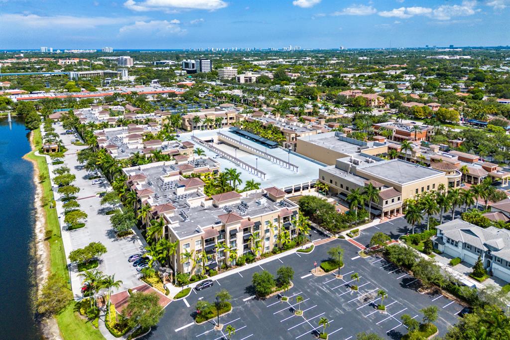 Live the Midtown Lifestyle where ''Location and Convenience'' are top of the list and everything is right outside your door. Residences at Midtown is a gated community within walking distance to Publix, Fresh Market, more than a dozen various style restaurants, urgent care, shopping on PGA Blvd. A few minutes' drive to beautiful beaches, PBI Airport, Downtown West Palm Beach, world class golf, boating & parks. This 2 bedroom 2 bath 3rd floor condo has private lush tropical views of the waterway from all living areas including the covered balcony, oversized gleaming tile flooring (with owner providing buyers' choice of master bedroom flooring, 2021 AC, all impact glass. Community amenities include luxurious clubhouse & fitness center, pool, pickleball, tennis, and more. No lease first Year Whether you're looking for an assorted choice of dining options, an there are an extensive range of self-care and personal services, specialty organic and natural foods, or need emergency medical care, Residences at Midtown has it all. Midtown even offers six electric vehicle charging stations! Come walk or ride along Mainstreet at Midtown to indulge yourself, get fit, shop, and dine in one convenient place, right outside your door. This mixed-use community has 225 luxury condominiums with one, two or three bedroom units.
This mixed-use community is also home to the Residences at Midtown, featuring 225 luxury condominiums. Other restaurants currently include Christophers Kitchen a (Vegan), Bone Fish Grill, Blaze Pizza, Jay Alexander's, Saito's Japanese, Texas Dr Brazil, Chipotle Mexican Grill. Shops are California Closets, Neaveau Health and Wellness, Socialite Vision, Fonda Lee Beauty Bar. Services include Fine Men's Salons, Core Evolution Fitness, Dragon Foot Spa and Massage, Dental Care, JFK Emergency Care, OXXO Care Cleaners, Theology Salon And Day Spa
