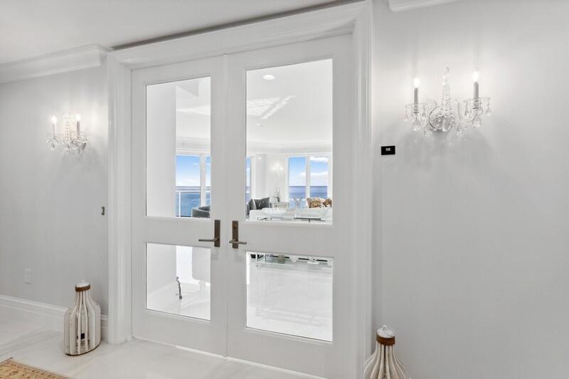 Welcome home to this spectacular direct oceanfront residence with all the bells and whistles, in the highly desirable Oasis building on Singer Island. This residence consists of the entire 9th floor with private elevator and entry and 360 degree of sweeping views of the ocean and intracoastal. This residence has been completely renovated and updated to the highest standards including: all high-end appliances and fixtures, brand new HVAC and water heater, new balcony floors, electrical blinds by Sarah Lopez Interiors (which alone cost about 74k), new kitchen, new bathrooms, new sheet-rock and paint throughout. The flooring throughout is 30x30 light marbling design porcelain tiles.Oasis has a private beach, saltwater pool, new renovated common areas, tennis court, underground parking.