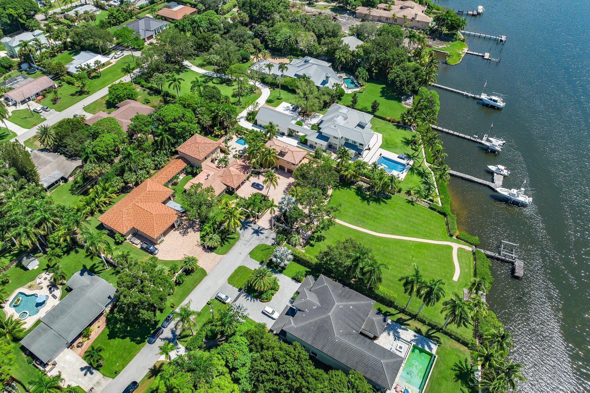 This presents to you the opportunity to acquire a waterfront, gated compound within the perimeter of Pennock Point on a private abutting street. 1.6 acres to make your very own, with over 150 feet on the wild and scenic Loxahatchee River. Wide water views with southerly orientation, minutes to the Jupiter Inlet and the blue water beyond. Priced at land value, on the property sits a recently updated original structure with 4 bedrooms and 5 baths. A newly constructed 3,000 square foot garage with 12 foot ceilings has room for even the experienced car/toy collector. A property worth viewing to see all the potential it holds.