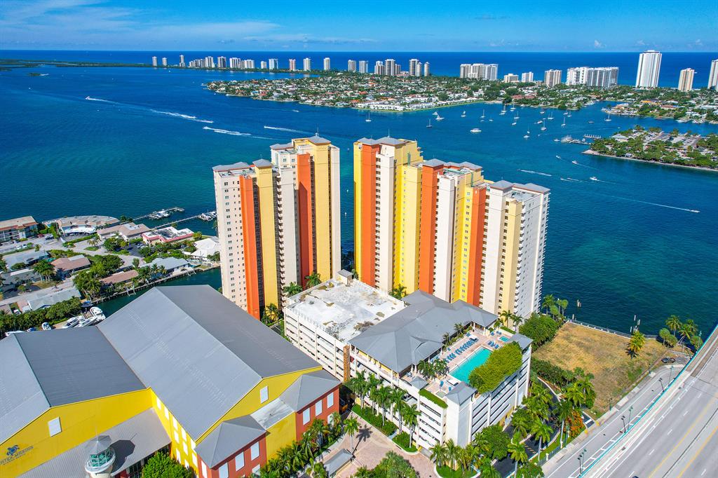 Very rarely do you find a unit that is better than new, but we are proud to say your search ends here! Welcome to this incredible 21st-floor unit with stunning Intracoastal and ocean views. Entering the unit, you are drawn to the oversized 36x36 tiles, custom kitchen, and elegant fixtures. Featuring 2 full bedrooms with an optional 3rd bedroom, this one has it all: hand-crafted cabinets, vanities, and built-ins in every room with slab-matched quartz countertops. The kitchen features all-black stainless Samsung appliances, a black stainless sink, double ovens, and waterfall quartz countertops. The entire unit was upgraded to LED lighting, with complete custom cove lighting in the formal living area. Truly one of the most improved units in Marina Grand, with no detail overlooked (over $200K in renovations). Marina Grand includes resort-like amenities: waterfront lobby, valet, recently renovated fitness center, private meeting rooms, jacuzzi, grills, and rooftop pool. Climate-controlled storage unit and one covered parking space included. Perfect as a primary residence or investment property. The recent assessment has been paid in full by the current owners. HOA includes high-speed internet, hot water, valet parking, and reserve funds.