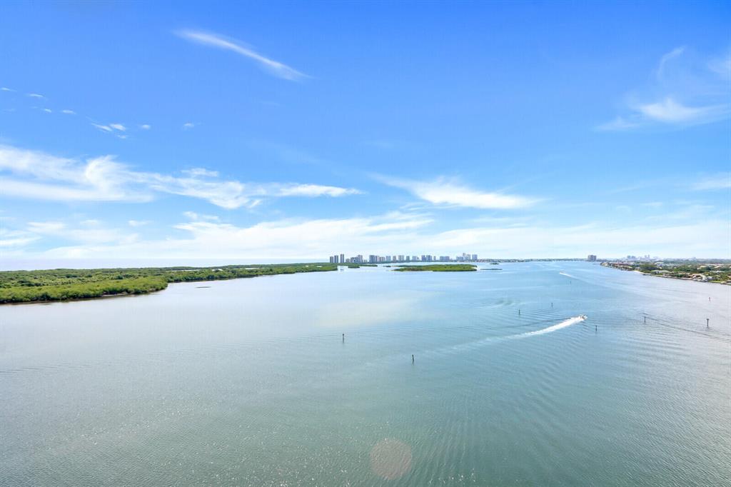 Gorgeous Unobstructed South Views of the Ocean and Wide Intracoastal Waterway. Largest two bedroom floor plan in the building.   Floor to ceiling windows and incredible views from every room. This unit is being offered furnished or un-furnished. Primary Bedroom features private balcony, two walk-in closets, double vanity, soaking tub and large walk-in shower.  The 22 x 14 Guest Bedroom is like a 2nd master suite featuring a large walk-in closet and spacious bath.  This luxury building is located at the point of the OPC peninsula surrounded by water and adjacent to the mega-yacht Marina & Restaurant.  New pool and gym are under construction.  24-hour concierge building and manned gatehouse. 2-Mile Waterfront Walking Path. Minutes to world-class shopping & dining. Gar Pkg 170 Storage 71