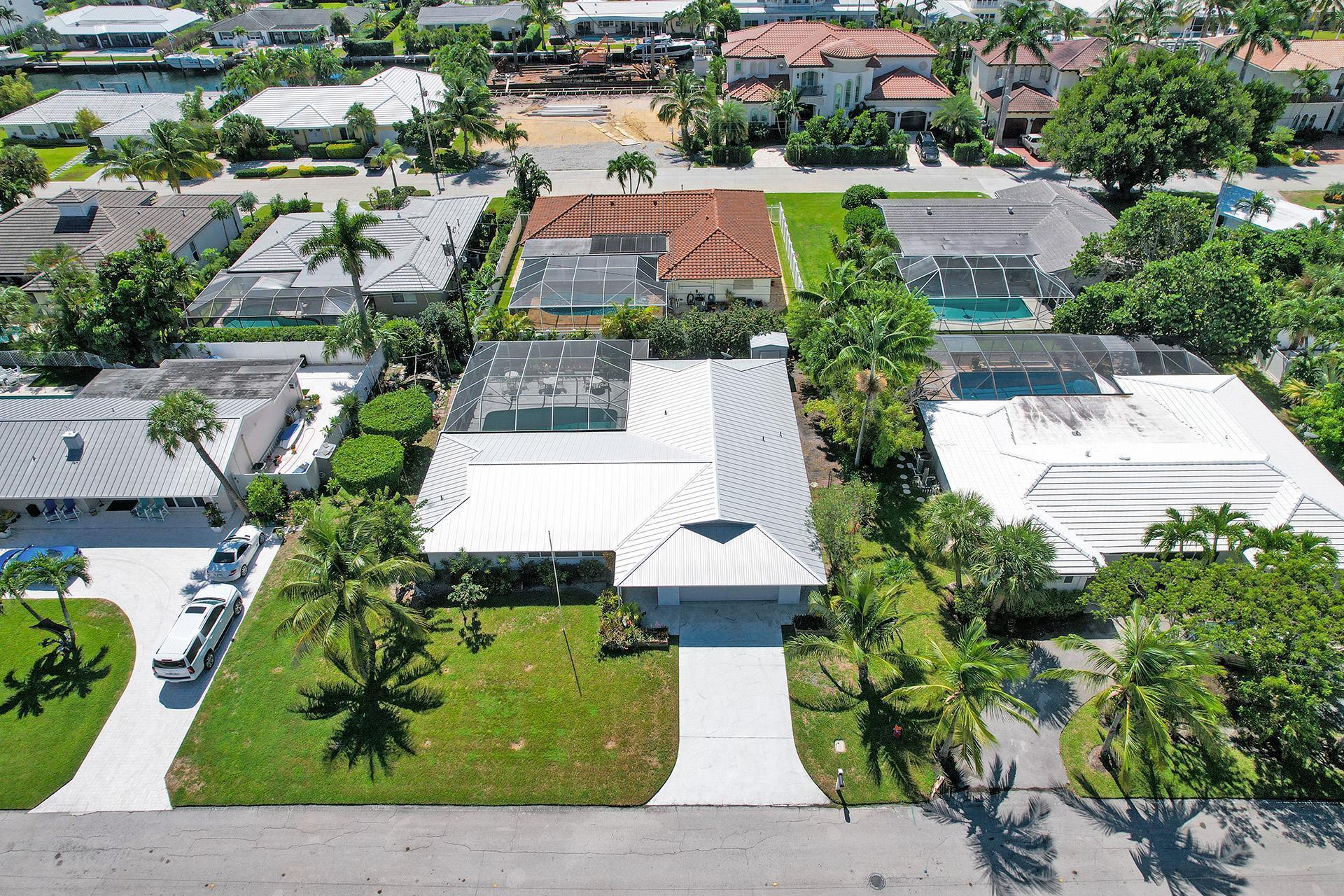 Your chance to live on Singer Island!   3 bedroom 2 bath home located in Palm Beach Isles.  2569 Total Sq Ft, 1776 Sq Ft under air.  Very large enclosed outdoor patio to relax around your Salt Water pool. Aluminum Roof 4 years old, Pool redone 4 years ago, Backup Generator 1 year old. Split bedrooms, central living room, and spacious two car garage with additional storage space.  Large 100' x 105' lot.