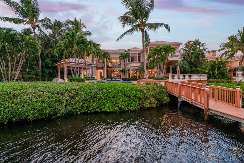 The Timeless Elegance of this Intracoastal Masterpiece Estate in The Club of Admirals Cove has never been offered before. The wide sweeping views of the Intracoastal and Jupiter Preserve from the 31,500 square foot lot are complemented by the unparalleled perfection and execution of the talents of the design team of Affiniti Architechts, Yvette-Parker Landscape, Decorators Unlimited and Turtle Beach Construction. The residence offers over 13000 square feet of total living area featuring the highest quality finishes in this 5 bedroom, 5 full bathrooms, 2 half bathrooms, study, theatre room, entertainers kitchen, and living room with bar. The Vision: To design and construct a comfortable flowing estate for family, friends, and charitable events along the Jupiter waterway. The waterfront resort oasis offers a vanishing edge pool, spill over spa, fountains, many patios and intimate lounging and entertaining areas with a swim up pool bar. The pool bar includes in water seating for 5 and exterior seating for 10 while watching the active Intracoastal waterway and enjoying your favorite cocktail in the soothing breezes. The private yacht dockage is the most sought after for a large in water vessel, a hoist for the center console tender and other water toys to experience the local or extended waterways of South Florida, the Florida Keys and Islands of the Bahamas. The stars have aligned to bring you one of the Best sites on the Intracoastal Waterway in  the Palm Beaches. The Perfect Residence in the Perfect Private Exclusive Club of Admirals Cove offering Five Star World Class Amenities, ranked one of the Best Private Clubs in the United States.