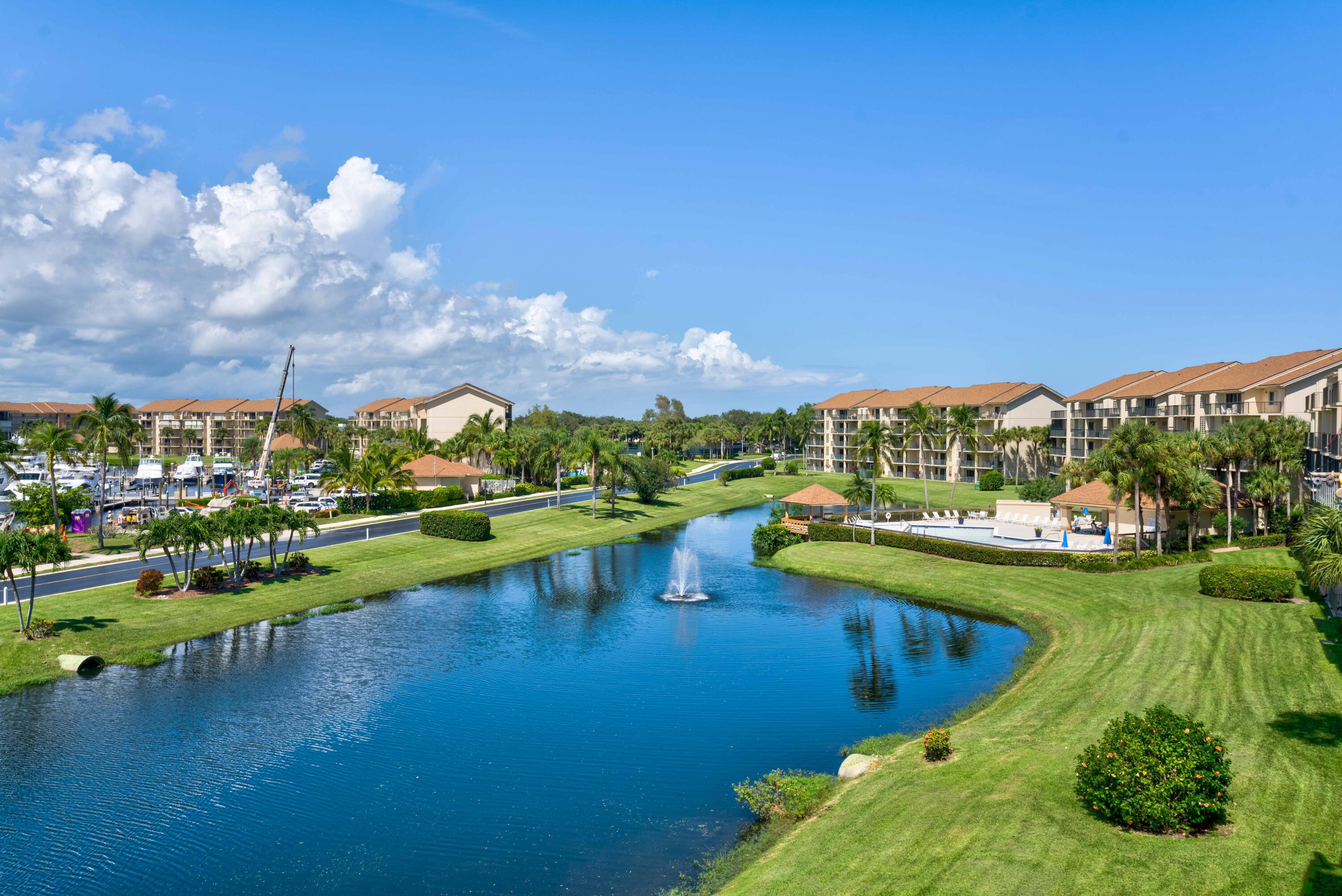 Walk to beach, supermarket, restaurants & shops. Short drive to movie theatre, golf, boating & PBI airport. This unit boasts a beautiful view of a lake and Marina.