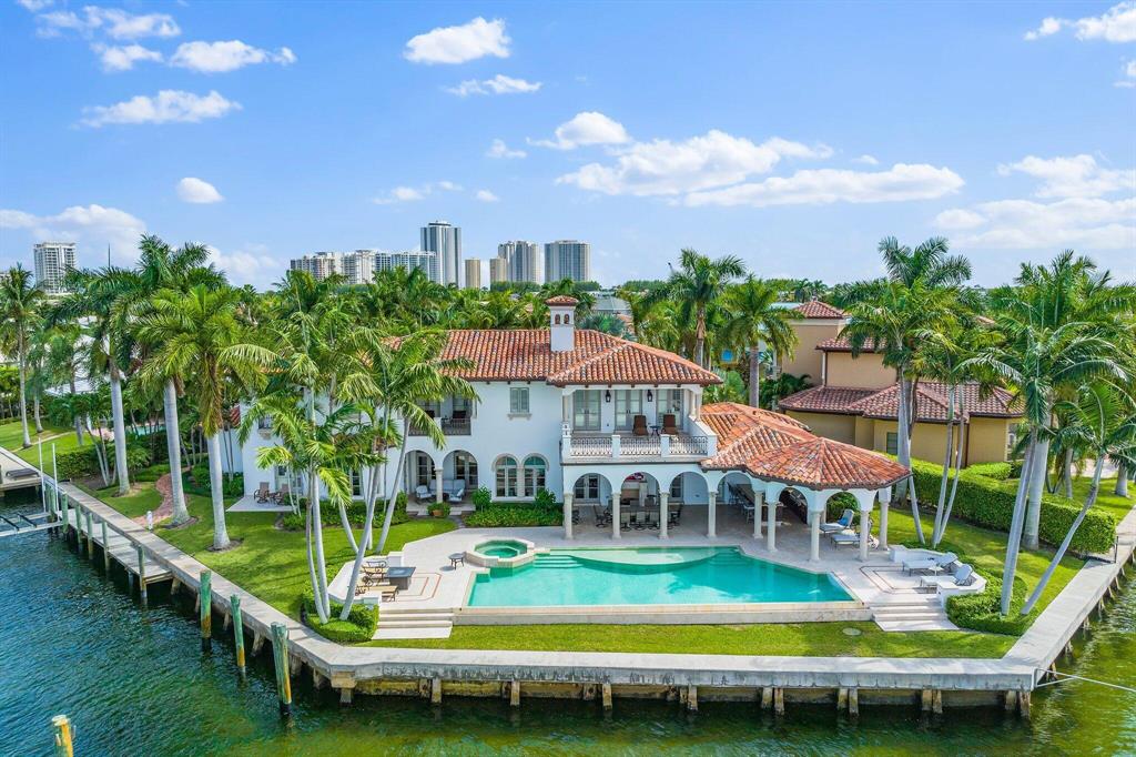 Built in 2008, this rare waterfront home boasts 230 feet of water frontage with spectacular panoramic views.  The current waterfront layout can accommodate a 100 ft. boat.  Sold fully furnished, the 9, 850SF home has a beautiful outdoor space: 5beds w/private en-suite baths. oversized loggias & terraces, summer kitchen & 50-ft infinity pool overlooking the water.  See Supplement: Built in 2008, this rare waterfront home boasts 230 feet of water frontage with spectacular panoramic views.  The current waterfront layout can accommodate a 100 ft. boat.  Engineered plans with seagrass survey are in hand to build a second dock on the ICW side with a boat lift.  The 9, 850SF home has a beautiful outdoor space: 5beds w/private en-suite baths. oversized loggias &amp; terraces, summer kitchen &amp; 50-ft infinity pool overlooking the water. Inside: Elevator leads to the master suite: private balcony, water views &amp; private laundry. Living area: open kitchen w/2 center islands, Wolfe stove, double ovens, granite counters, high-end appliances, custom lighting, grand dining room &amp; living room. Built in '08 the home has a private study &amp; multi-purpose area. Features include custom moldings and hurricane impact windows throughout as well as hand-carved coral stone fireplaces, and Pecky Cypress beams.  Near restaurants, shopping &amp; ocean.  Rarely does a property come on the market that can accommodate multiple vessels of multiple sizes.