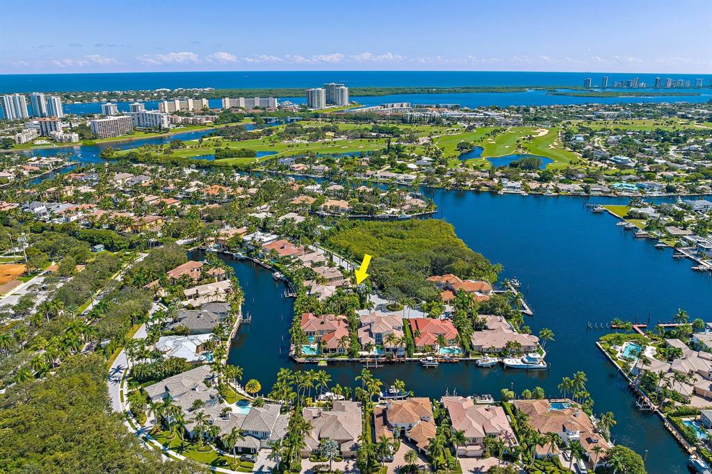 BOATER'S PARADISE!  Gracious + Elegant Harbour Isles Home on Prime Cul de Sac lot. This property offers 93' on extra wide canal with Easy Ocean Access via 2 INLETS (Jupiter and Palm Beach).   Custom designed by award winning architect Randall Stofft, this home has been Impeccably maintained by the original owners.  An expertly designed floor plan creates a lovely setting for fine living indoors + out.  A lushly landscaped circular drive + 3 CG offer ample parking.  Entry features a double height ceiling + grand winding staircase.  The first floor interior includes an expansive living room w/ fireplace + oversized windows, a spacious office with full bath and a guest BR w/ ensuite.  Gourmet kitchen w/ Sub Zero + Dacor appliances (natural gas) opens to breakfast nook + spacious family room. Design elements include custom 8' wood doors throughout, marble flooring and exquisite coffered ceilings.  Upstairs is accessible via stairs or private elevator.  Upper landing is graced by Hickory wood floors, a tranquil library and a morning bar leading to the grand Owner's suite.  This primary suite offers privacy + serenity and all the comforts of luxury living, including a romantic lanai.  Additional upstairs bedrooms all have ensuite baths and generous closets.  All 4 A/C's are newer and the 50 KW generator was just upgraded. Nest A/C, Sound System + High Speed WiFi boost. Outdoor area offers great ambiance, blending scenic wide canal w/ enchanting landscaping, lights + pool area. The pool was recently resurfaced and comes with a 10 year warranty.  82' dock is outfitted with lights and electric.  Dog lovers will treasure the picturesque nature preserve across the street (a 21 step walk door to door!). This prime location is across the canal from the fabulous North Palm Beach Country Club and Jack Nicklaus golf course - open to the public.  A short walk or drive to world class shopping, dining, beaches, educational and cultural venues.   20 minutes to PB Int'l airport.  Truly a fabulous place to live and enjoy the Florida lifestyle...  Owner will consider bitcoin.