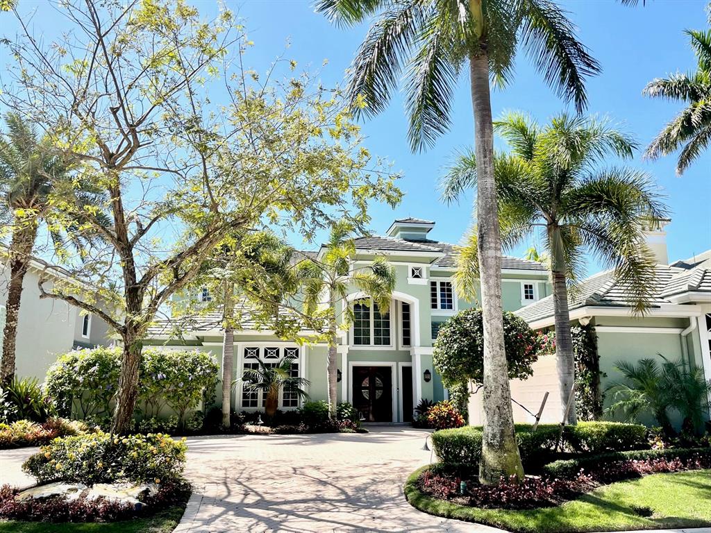 RARELY OFFERED. The Harbour is an 11 home enclave on a  cul de sac. Sophisticated 4BD/5BA/2 half bath custom estate w/over 6700 sq/ft. Large club room/theater room also converts to addl 5th bedroom. Breathtaking lake/golf views. Enjoy yachting from deeded trex dock for large yacht steps away. Seconds to intracoastal. Sleek modern chefs kitchen w/burlwood cabinetry/butler pantry. Climate controlled wine room.  Elevator leads to a primary BD full wing w/huge custom closets, balcony w/hot tub, media room. Formal living room/dining room. Full home lutron automation. Savant audio visual system. Marble floors w/inlays. 3 CG w/AC/Storage. 60 KW full house generator. Impact windows/doors. Resort style heated pool/spa w/cascading waterfalls and misters. New pool heater. Club membership optional.