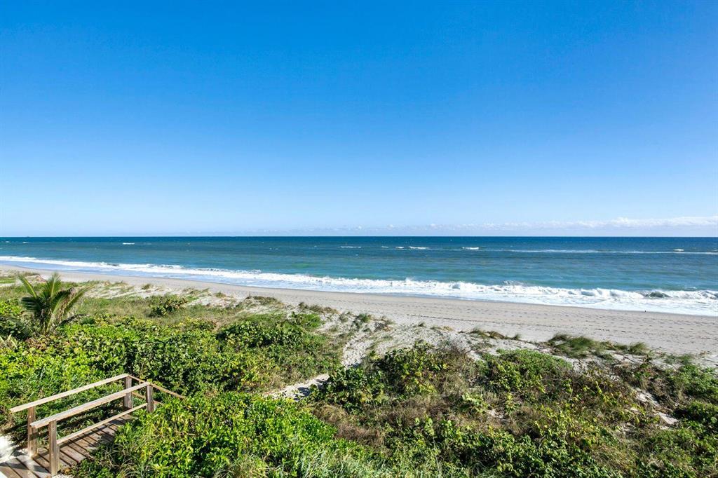 RARELY OFFERED DIRECT OCEANFRONT ULTIMATE JUNO BEACH TOWNHOME Step out the door to white sands of the Atlantic Ocean. Bright airy modern coastal retreat boasts magical turquoise ocean views from floor to ceiling impact sliders. 3BD/3 1/2 BA totally reconstructed in 2020 by top architect and designer. Bedroom w/office, custom built in wet bar w/refrigerator, icemaker, sink and wine fridge. Two oceanfront large balconies w/seamless glass railing. Additional features include porcelain tile light wood floors thruout, all new marble baths, walk in custom fitted closets, Custom built in w flat screen TV, 85 inch club room TV w/sonos, New washer/dryer. All impact sliders and electric hurricane shutters. Property manager included in LOW HOA dues. Walk to dining and shops. Very Private/Secure!