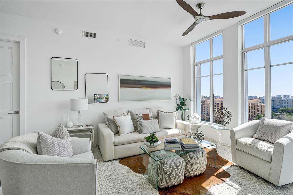 Finally a home that lives up to expectations!  Tower 155 where the city meets the shore... This rarely available lower penthouse house unit exudes quality and easy living the minute you step through the front door.  Stunning city and distant ocean views abound from every vantage point.  This home was professionally decorated in a casual coastal contemporary decor.  This 2/2 features 2 split Primary suites with finished walk-in closets  An open kitchen with commercial grade stainless steel appliances makes entertaining a breeze.  A large walkout balcony provides endless views of the city and ocean.  2 deeded parking spaces.  This is a full service building complete with Concierge and Valet.  Walk to beach, Mizner Park and new Brightline Station.  This one checks all the boxes!!