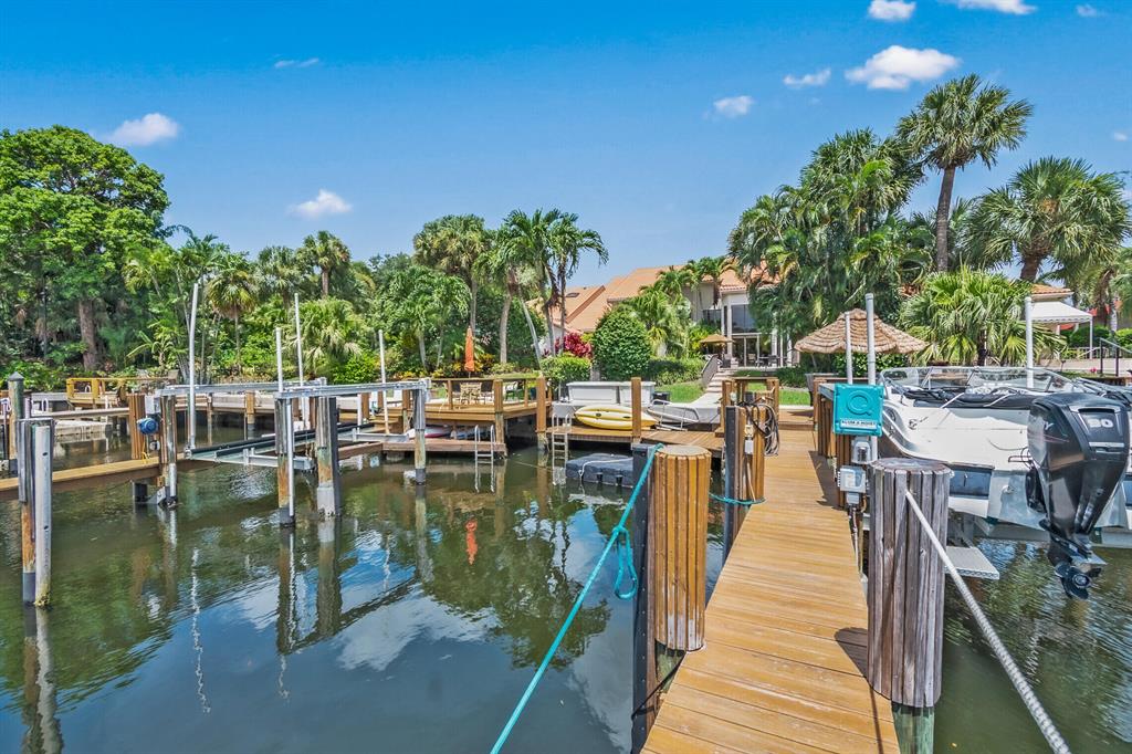 Exceptional deep water residence with rare OPTIONAL club membership within the spectacular community of Frenchman's Creek Beach and Country Club. Neighbor to only nine other homes this no fixed bridges direct Intracoastal home features two private docks with a 7,500 lb. lift with up to 70 ft. allowance making this a true Boaters paradise. (See supplement remarks for full details) Exceptional deep water residence with rare OPTIONAL club membership within the spectacular community of Frenchman's Creek Beach and Country Club. Neighbor to only nine other homes this no fixed bridges direct Intracoastal home features two private docks with a 7,500 lb. lift with up to 70 ft. allowance making this a true Boaters paradise.

Ideally situated in a hurricane safe location this spacious plan offers 3 bedrooms + den/office and 2 car garage. Interior features include elegant marble flooring, lofty ceilings throughout with expansive near floor to ceiling windows that frame the splendid outdoor area and picturesque vibrant tropical landscaping. The recently renovated open kitchen offers a newly upgraded appliance package, a cozy breakfast nook and overlooks the living room to delightful views.

The ground floor owner's suite features his and her baths and is conveniently adjacent to the considerable office/den. The second floor features 2 accommodating en-suite guest rooms and ample storage space. Well maintained with a new roof(approx. 4 years), air purification system and nearly new 3 zone air conditioning. The outdoor oasis offers and generous space for poolside entertaining (new electric heater recently installed).

Hurricane protection includes; front door impact, all impact glass on the second floor, rear windows offer partial impact and shutters for the non impact windows.

Purchase of this waterfront haven includes; a 2014 17.5 ft. Caravelle Bow Rider with a 95hp Mercury outboard and new battery, his and hers kayaks, paddle board and on dock storage. Truly the quintessential home for the avid boater and water sports enthusiast.

Association fee includes: Full time security (24/7 canine patrol, perimeter fencing, waterway patrol and alone monitoring services and paramedic service), premium cable TV, high speed internet, hurricane cleanup service, Infrastructure reserves for maintenance of waterways, lamp post, street light maintenance and repair, humane wildlife control, vendor screening, notary and package receipt services, community direct connection to Florida Power and Light substation, dog park and fishing lake maintenance, exterior home painting every 6 years (trim every 3 years), property landscaping- fencing and irrigation and pressure cleaning of gutters and driveways.