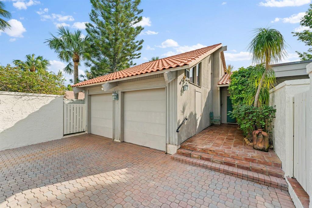 Steps from the ocean in the gated boutique community of Ocean Walk, this lovingly maintained 3 BR / 3 BA pool home is the perfect home for the beach lover.  Light and bright, it has a great southern exposure on a corner lot with a heated pool and an expanded lanai. Move-in now or make it your own over time!