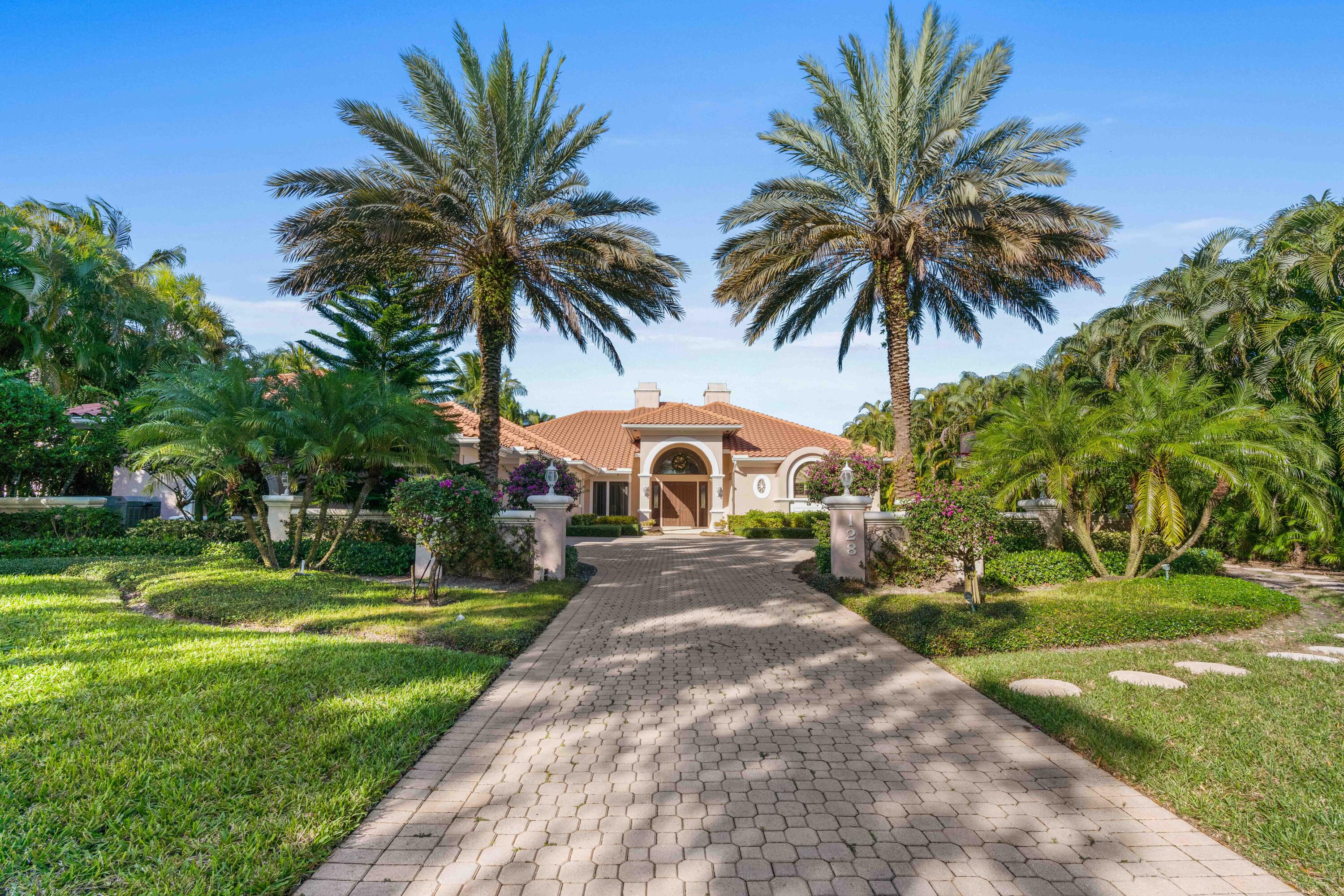 Enjoy wide water views in your backyard and serene golf views in front! Over a half acre on a favorite street in Admirals Cove, this spacious custom home features 5 bedrooms, 6 1/2 baths plus an office, and an attached guest house with a separate entrance, bedroom, bath, sitting room, and kitchenette. Spacious master suite, 3 bedrooms with en suite baths. Marble floors, 2 sided fireplace, volume ceilings, generator, kitchen with Wolf 6 burner gas range, wolf wall ovens, and warming drawer. Large backyard with 40' pool, 100 feet of water frontage, and dock for up to 70' yacht with quick access to ICW and no fixed bridges to ocean. This preferred location offers the rare opportunity to renovate or build your dream 11,000 sq ft custom estate. Required golf membership purchase conveys all the first-class amenities of Admirals Cove, including two spectacular clubhouses, 45 holes of golf, 5 restaurants, 58 slip marina with floating docks, a Yacht Club, 10 har tru tennis courts, 8 pickleball courts, state of the art fitness and wellness center with Technogym machines, 21,000 sq ft brand new spa &amp; salon, 30 room Waterside Private Boutique Hotel for members and their guests, brand new Golf Learning Center, Covesters kids club and Platinum service.